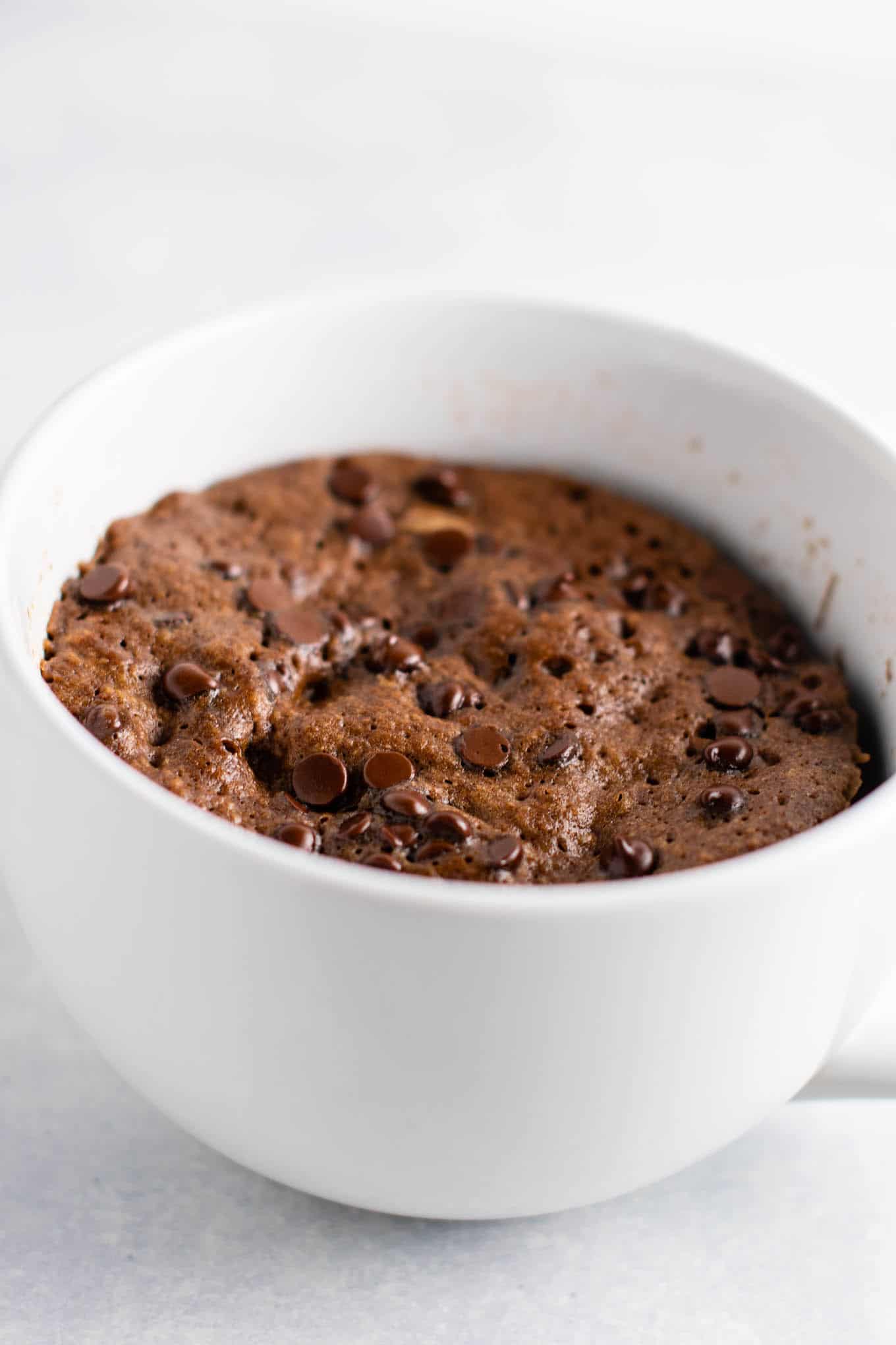 Gluten free chocolate mug cake made with easy to find flours. Perfectly fluffy and so decadent - serve with ice cream!