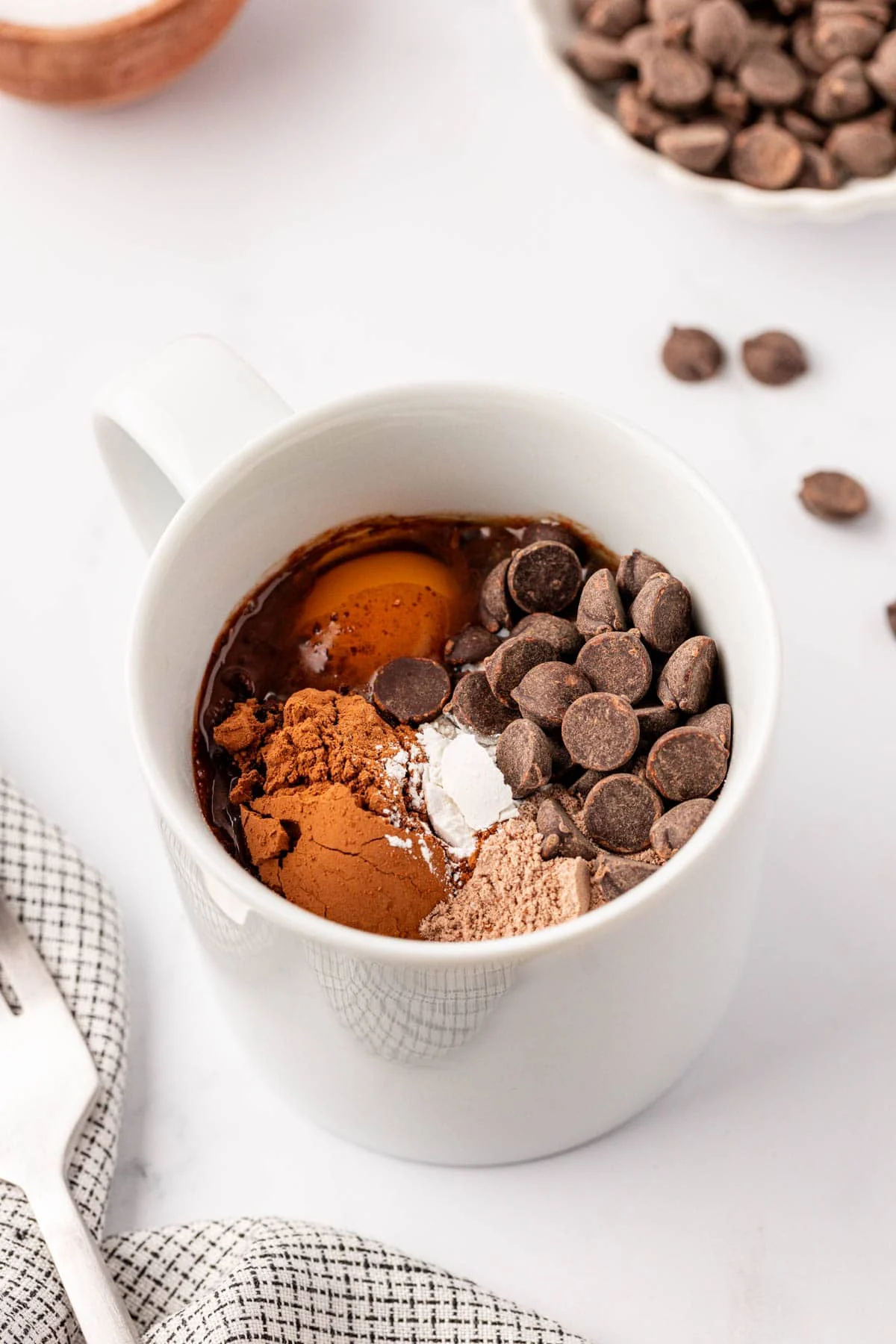 protein mug cake ingredients in a white mug