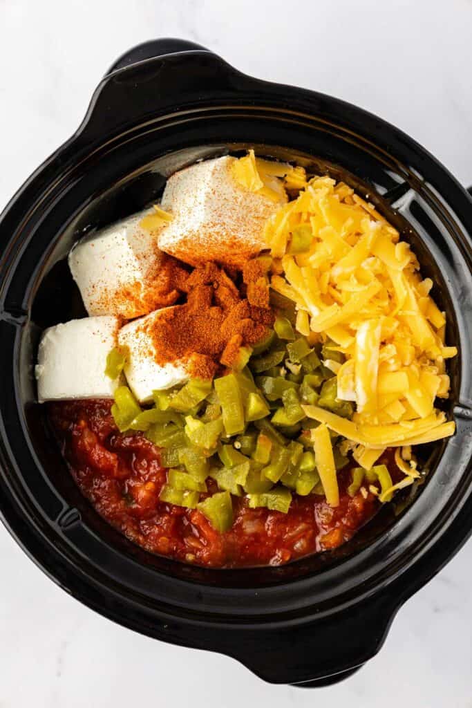 slow cooker queso ingredients in the crock pot