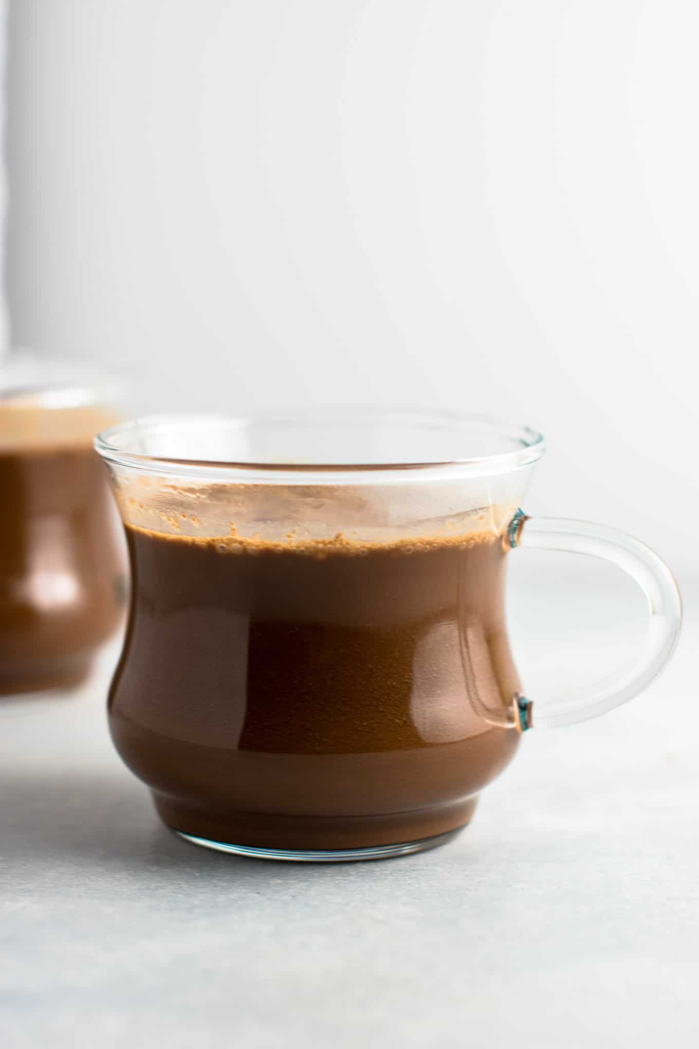 Easy 4 Ingredient vegan hot chocolate recipe made with almond milk. Dairy free, gluten free, and vegan. The perfect cozy winter drink! #vegan #hotchocolate #drinks #christmas #dairyfree