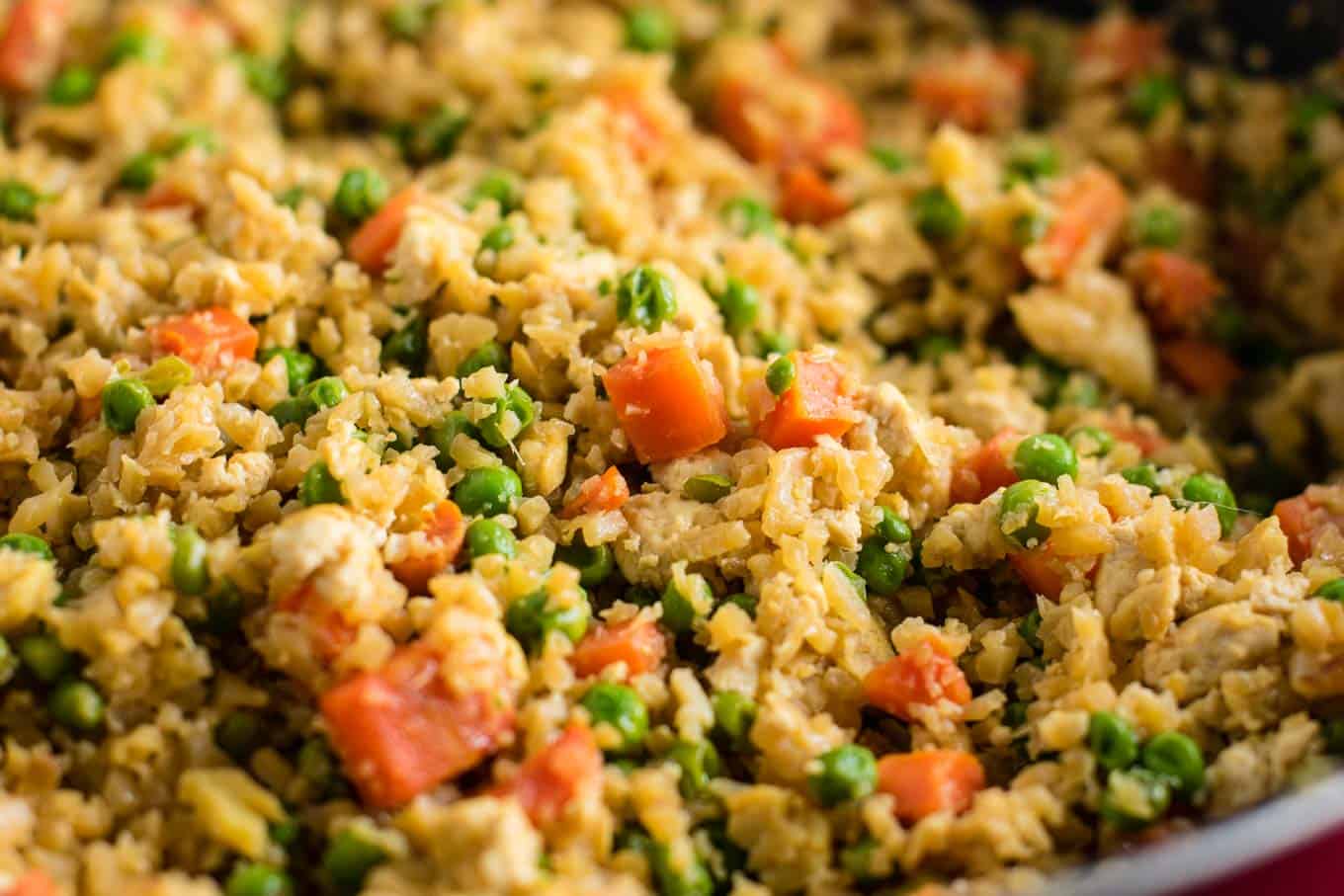 This cauliflower tofu fried rice is vegan, gluten free, grain free, and low carb. You won't believe this doesn't have rice or eggs in it! My new favorite dinner recipe! #grainfree #glutenfree #cauliflowerfriedrice #tofufriedrice #vegan #dinner #eggfree