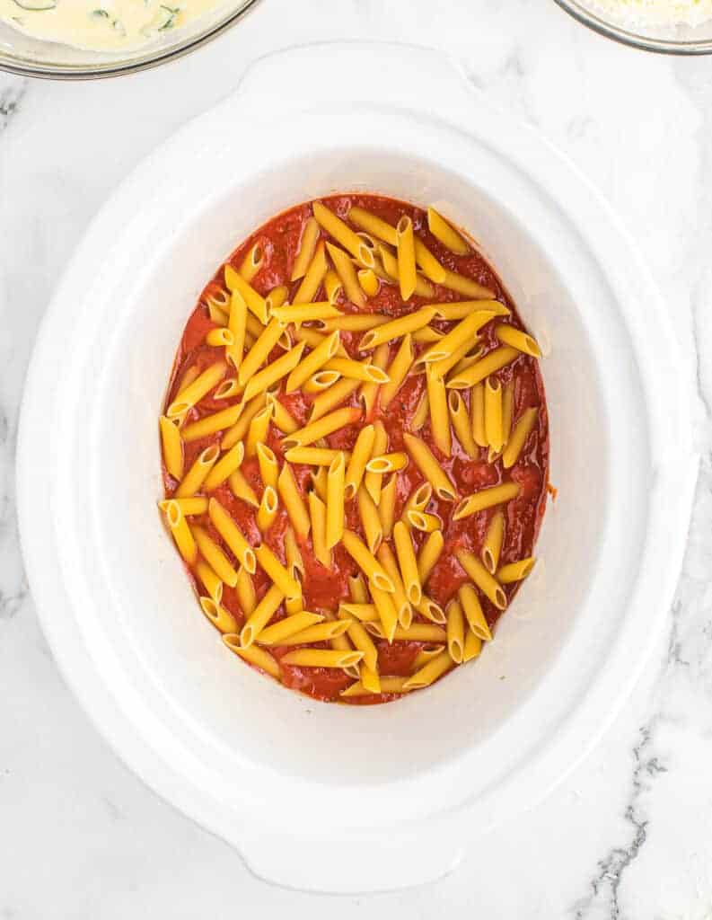 penne layer added to the slow cooker
