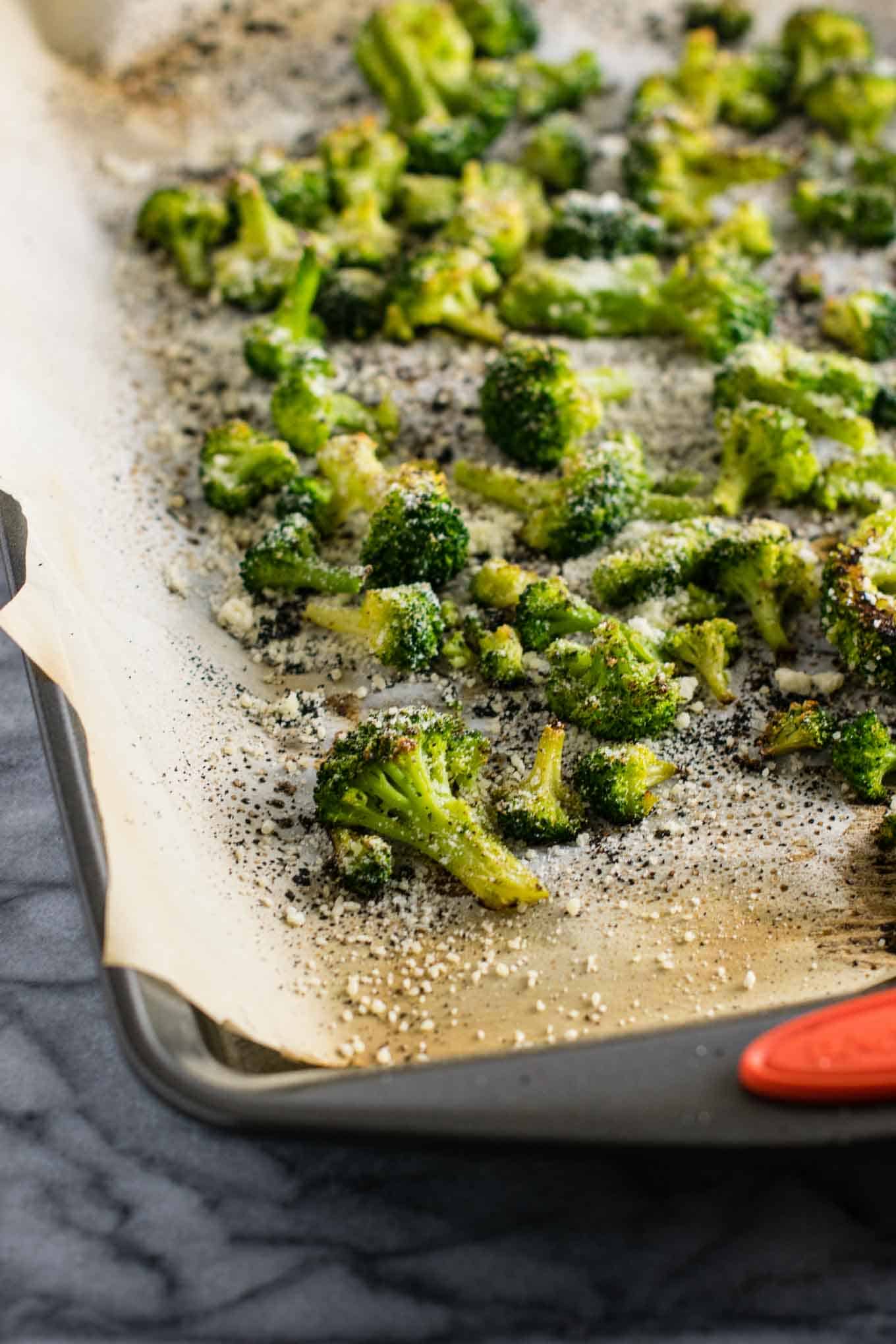 finished roasted broccoli on the baking sheet