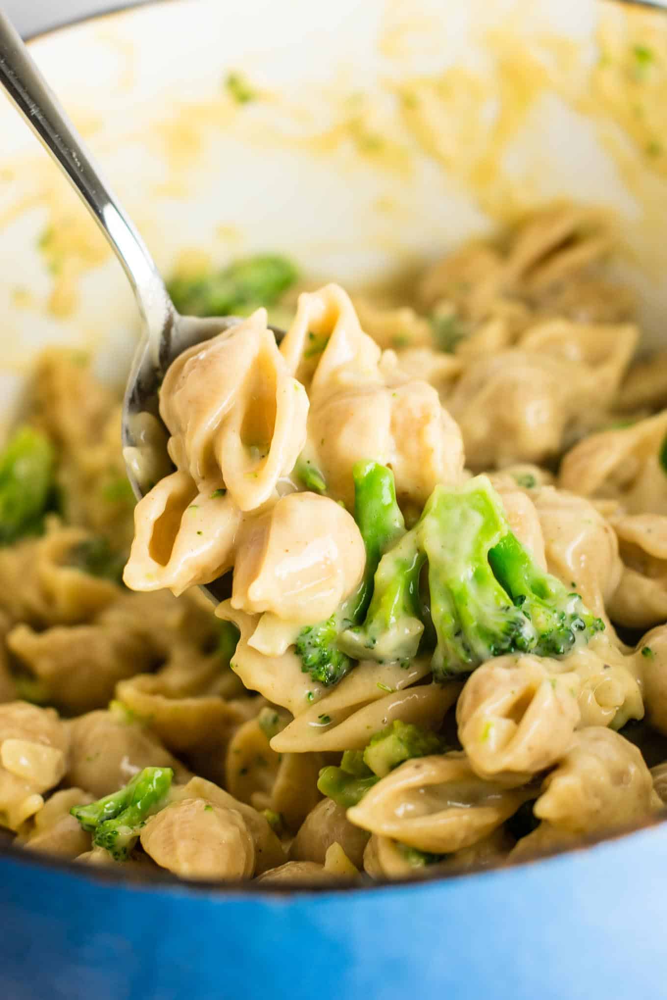 Lightened up broccoli shells and cheese with sharp cheddar cheese and whole wheat pasta. The healthiest way to justify eating macaroni and cheese for dinner. Kids will love this one! #broccolishellsandcheese #macandcheese #healthy #dinner #vegetarian #meatless #pasta #wholewheat