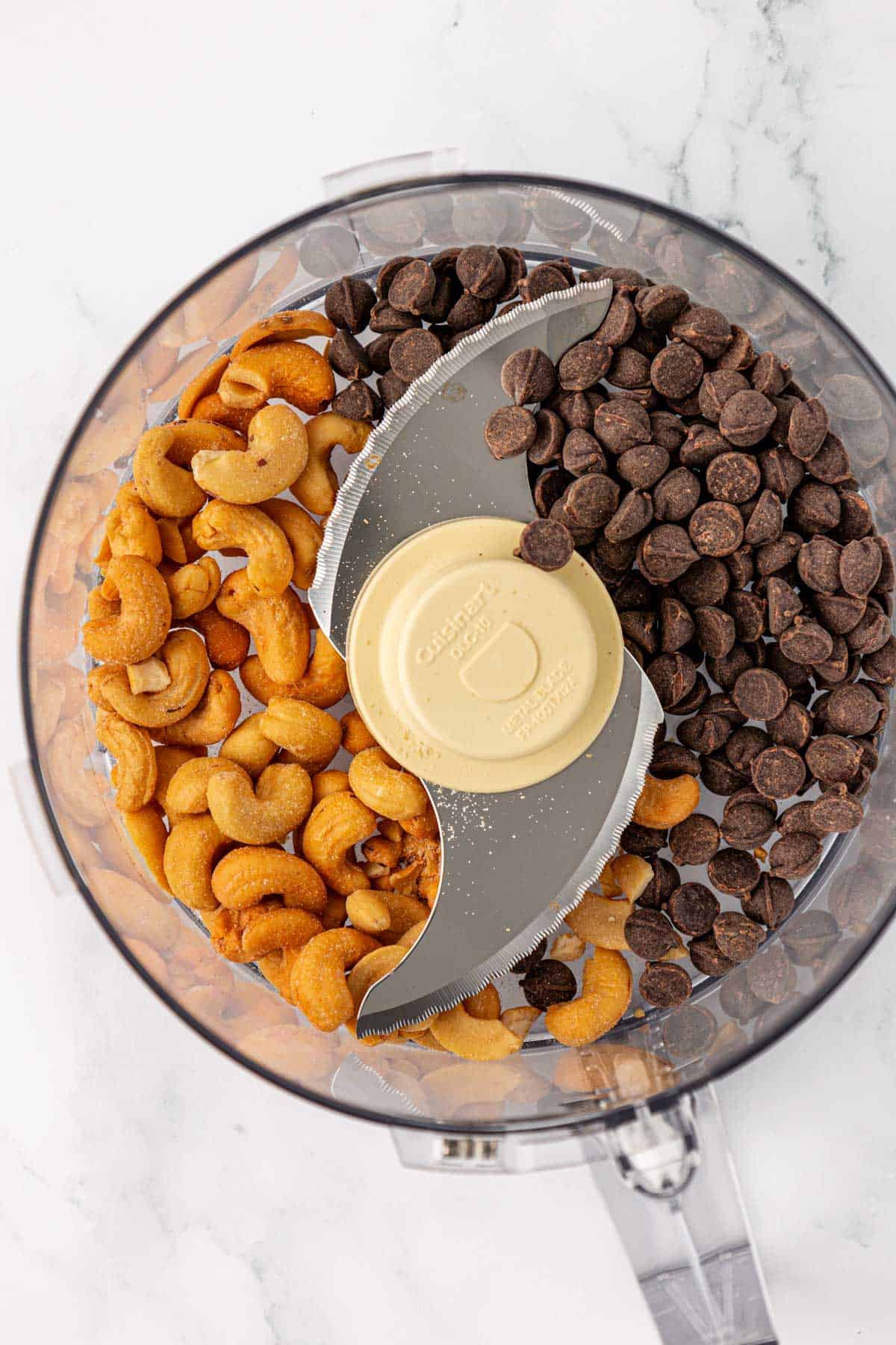 dark chocolate chips and cashews in a food processor