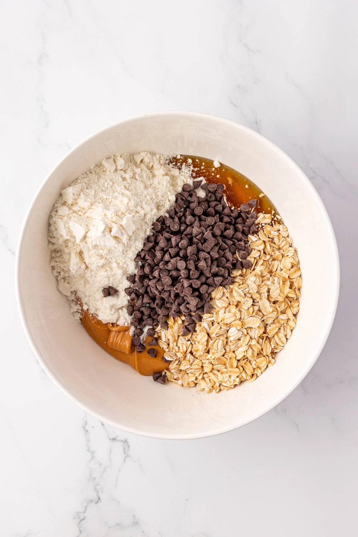 protein bar ingredients in a mixing bowl