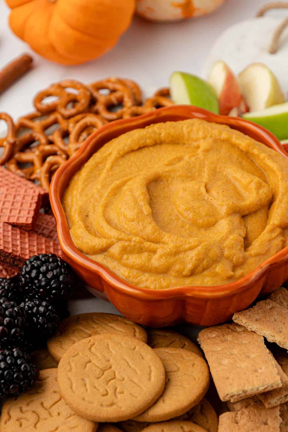 bowl filled with pumpkin cream cheese dip