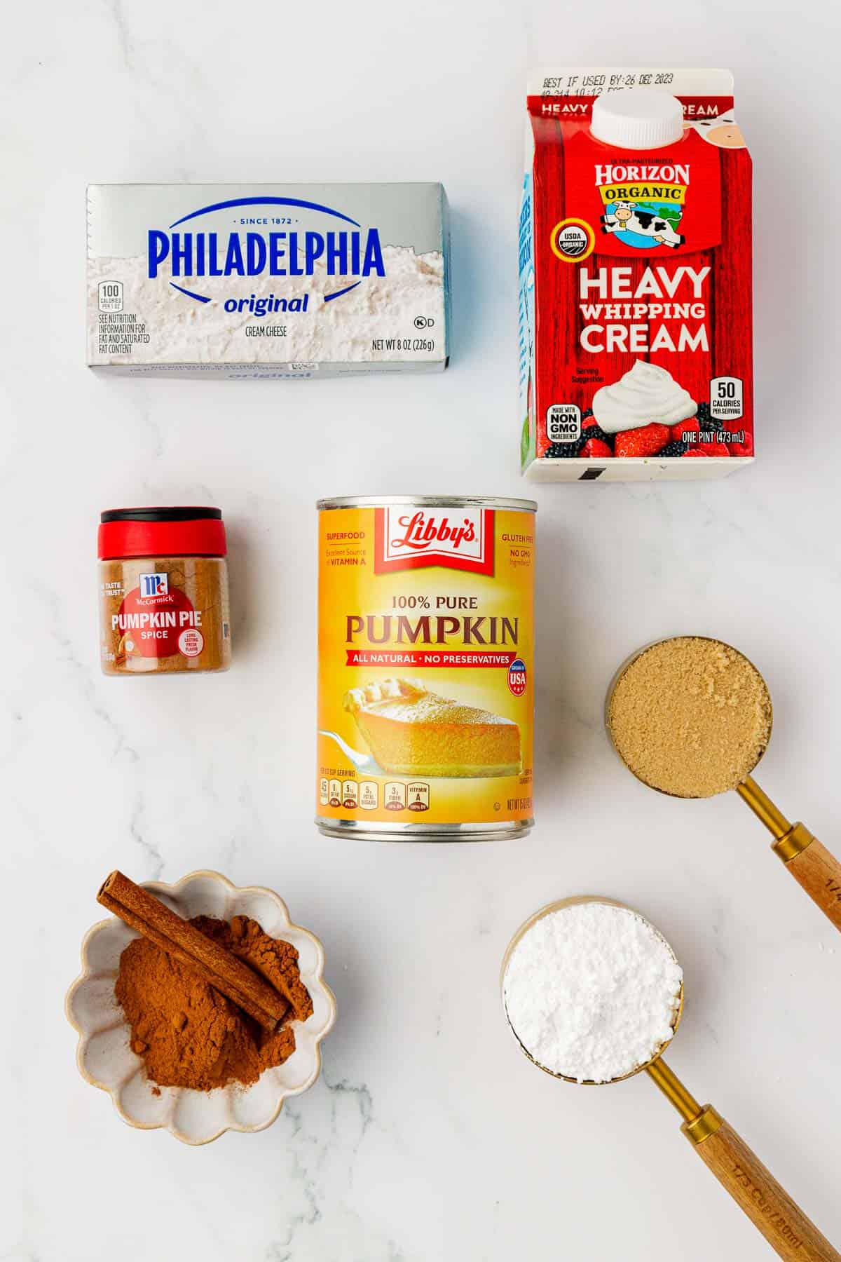 cream cheese, heavy cream, pumpkin puree, brown sugar, pumpkin pie spice, powdered sugar, and cinnamon