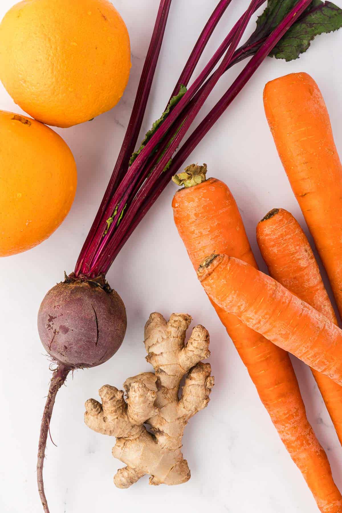 carrots, oranges, beet, and ginger root