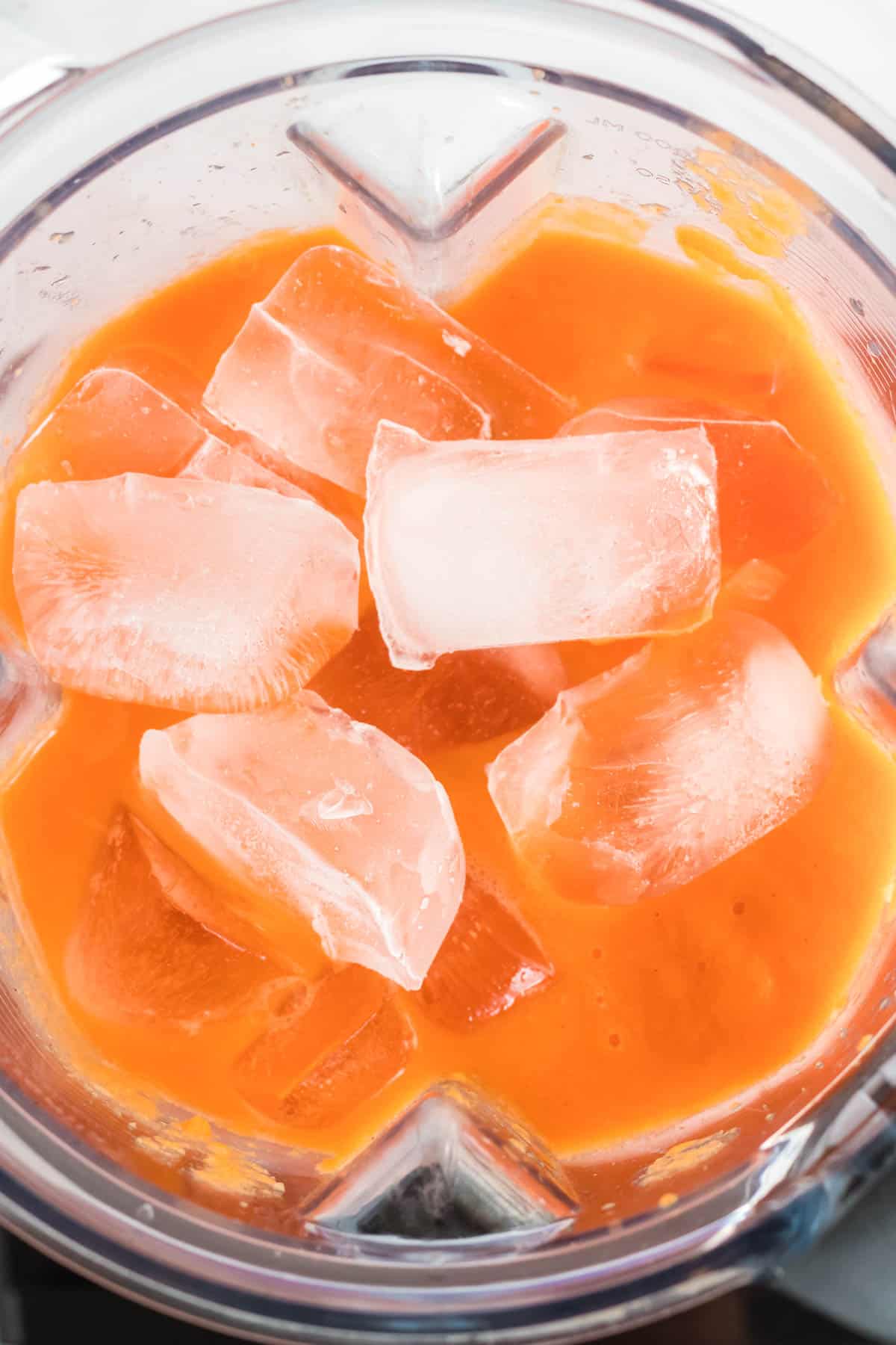 adding ice to the blender