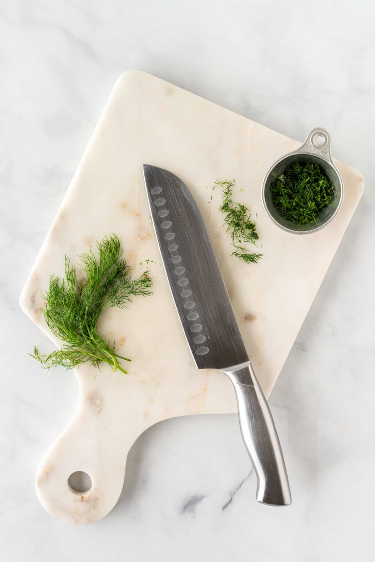 cutting up fresh dill