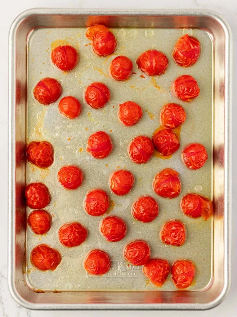 roasted cherry tomatoes on a baking sheet