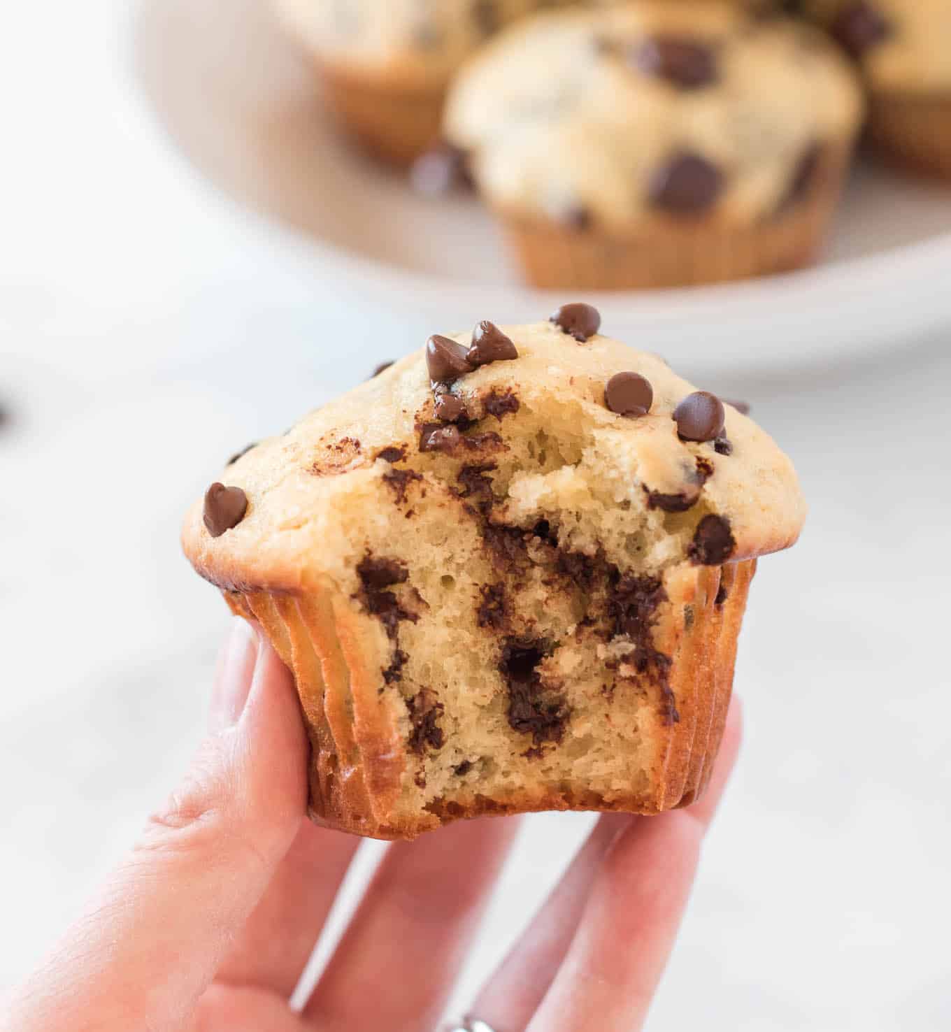 greek yogurt chocolate chip muffin with bite taken out