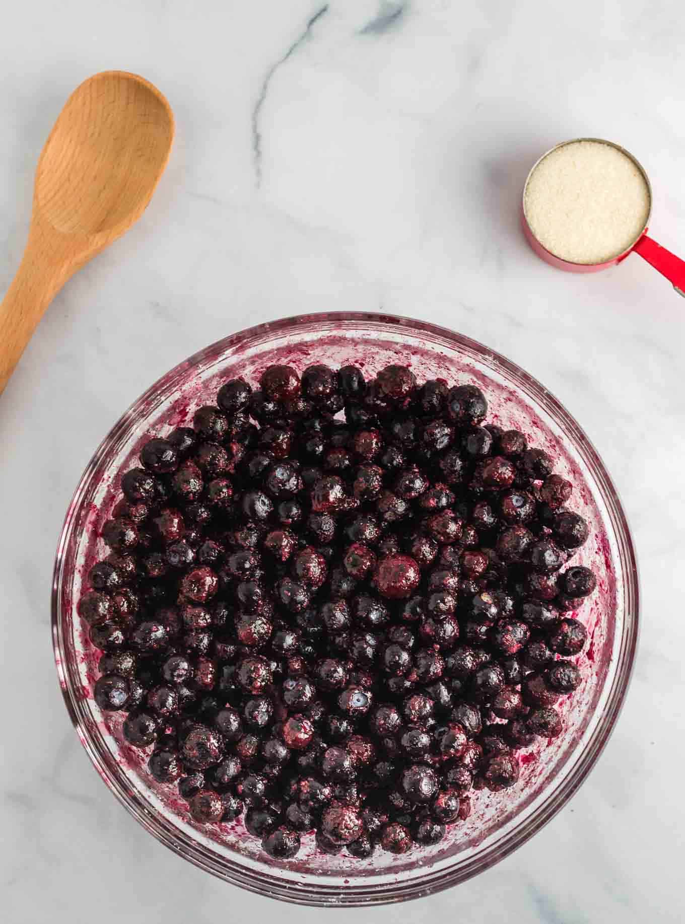frozen blueberries in a clear bowl