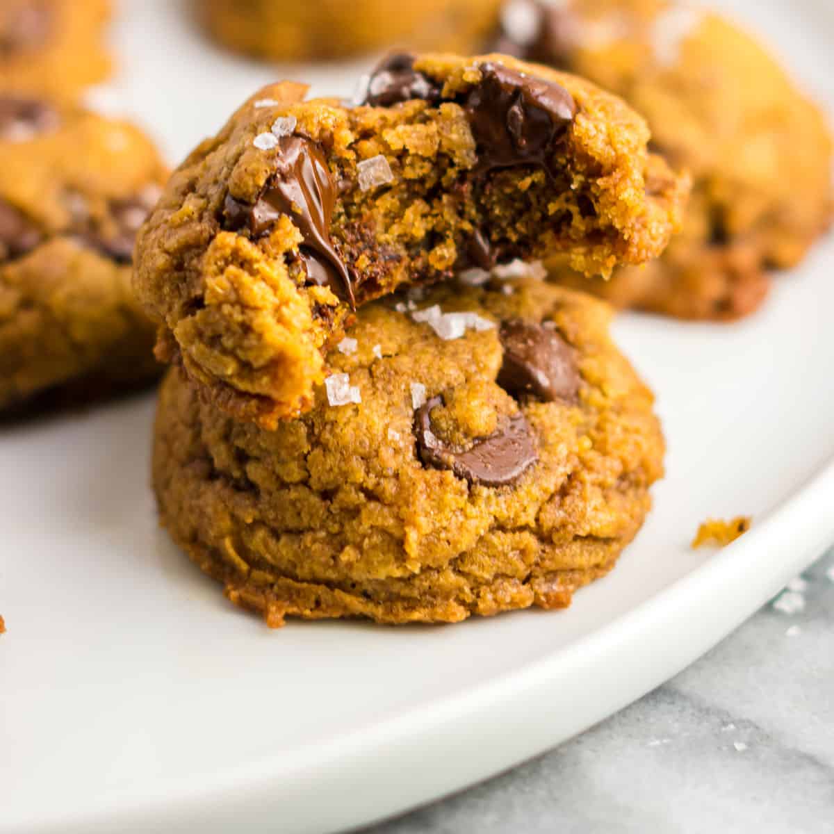 vegan pumpkin chocolate chip cookie with a bite taken out