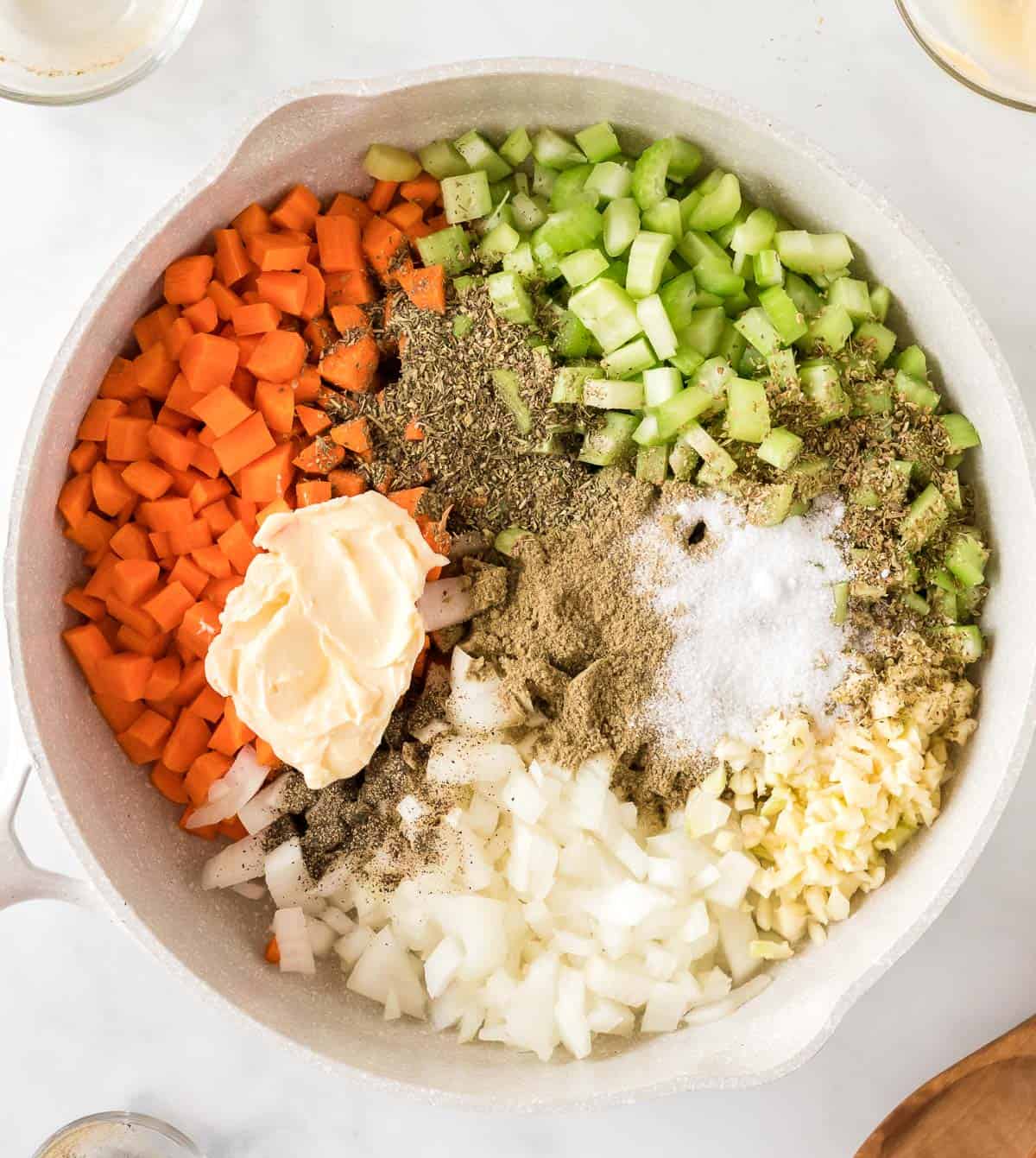 adding vegan butter and spices to the vegetables