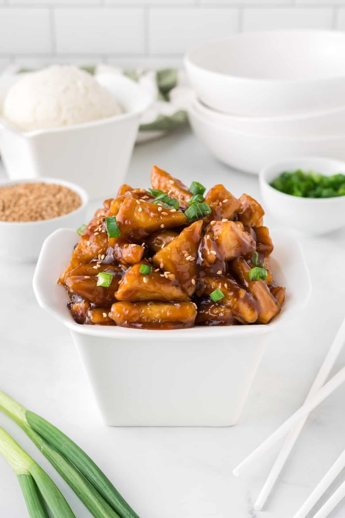 takeout container filled with teriyaki tofu
