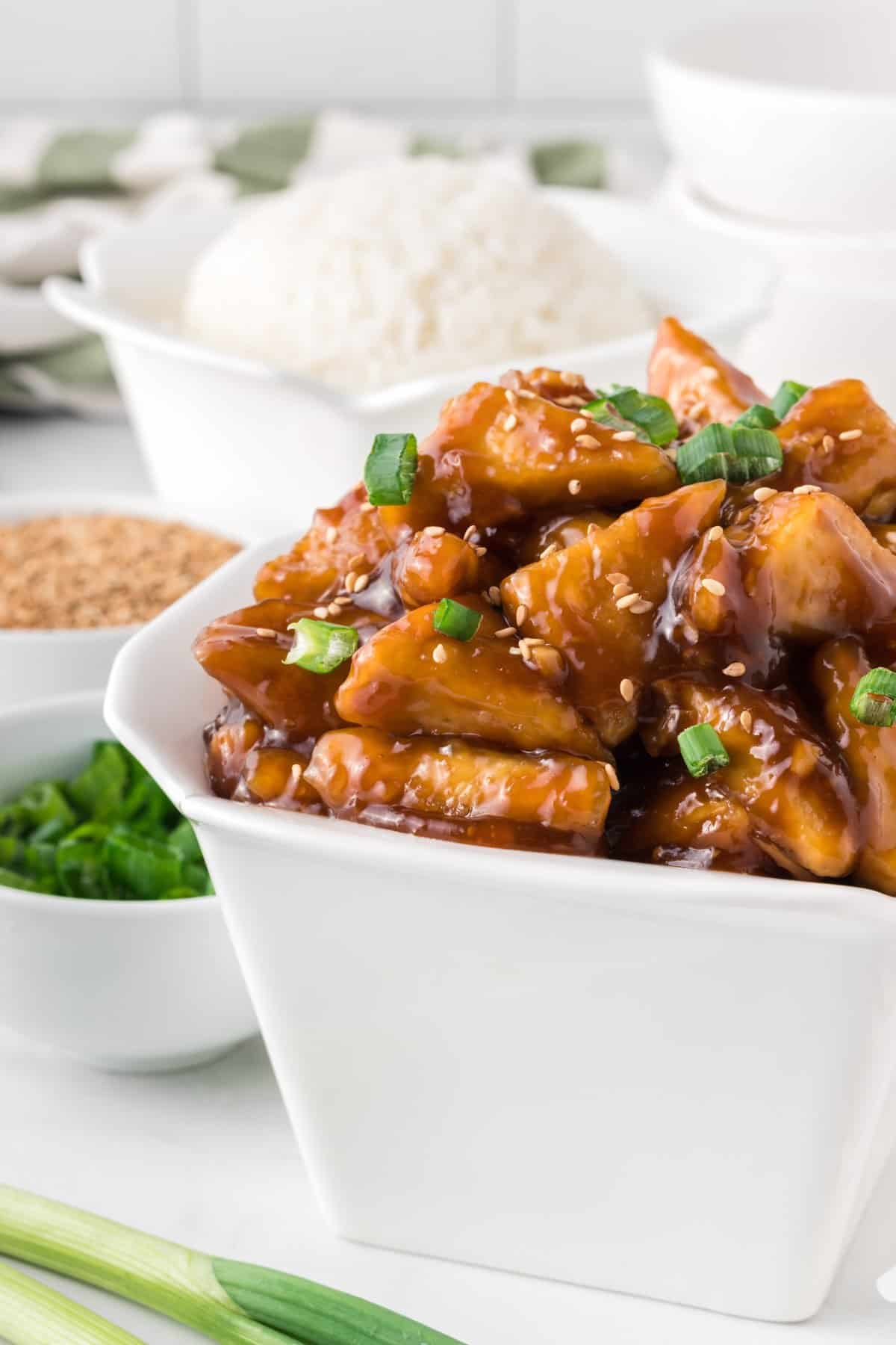 takeout container filled with teriyaki tofu