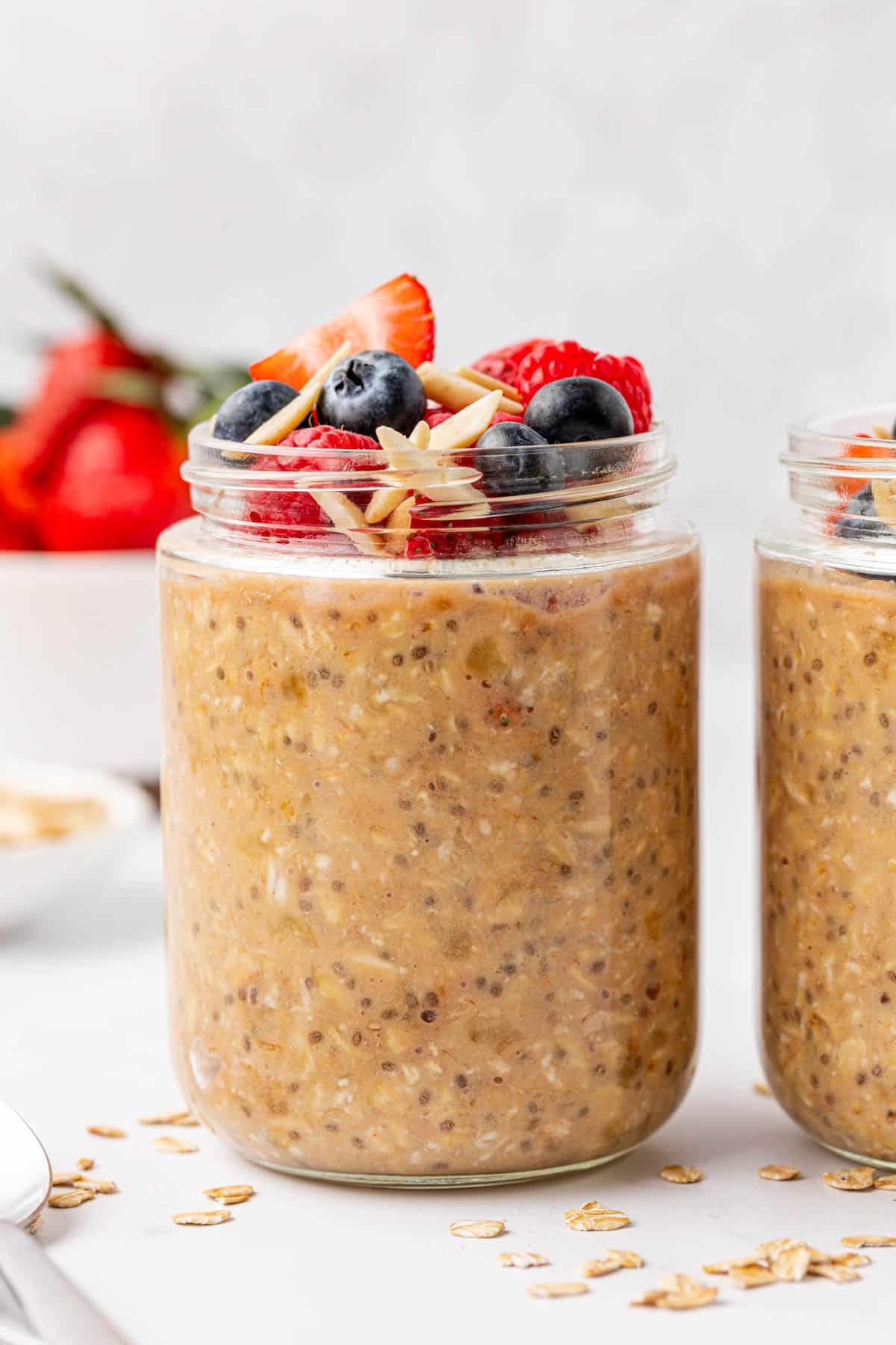 protein overnight oats topped with berries and almonds