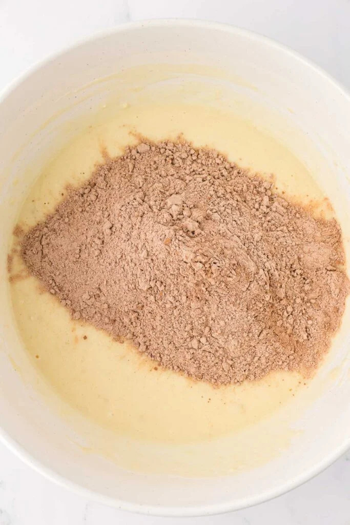 adding the dry ingredients to the wet ingredients