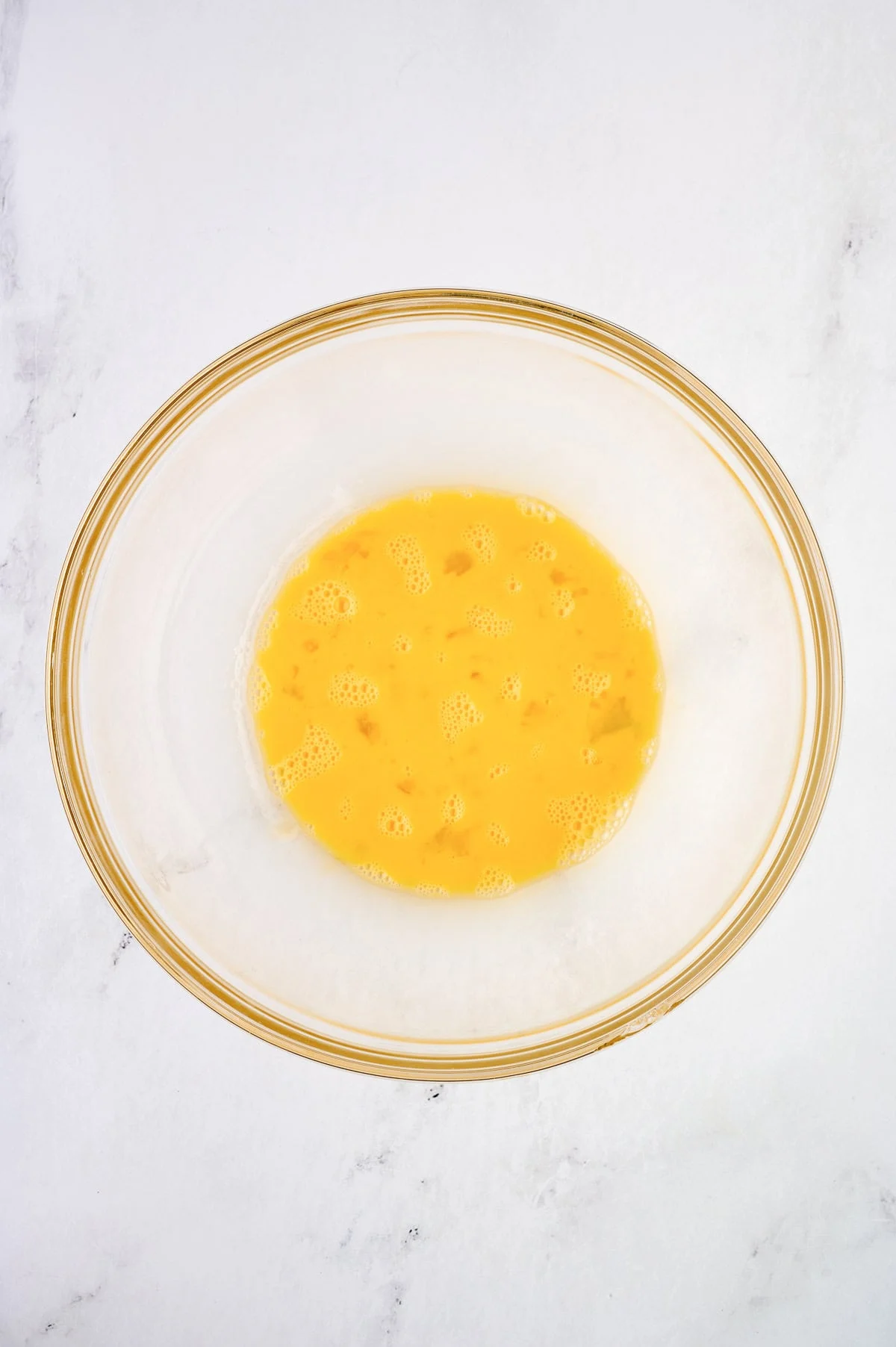 whisked eggs in a mixing bowl