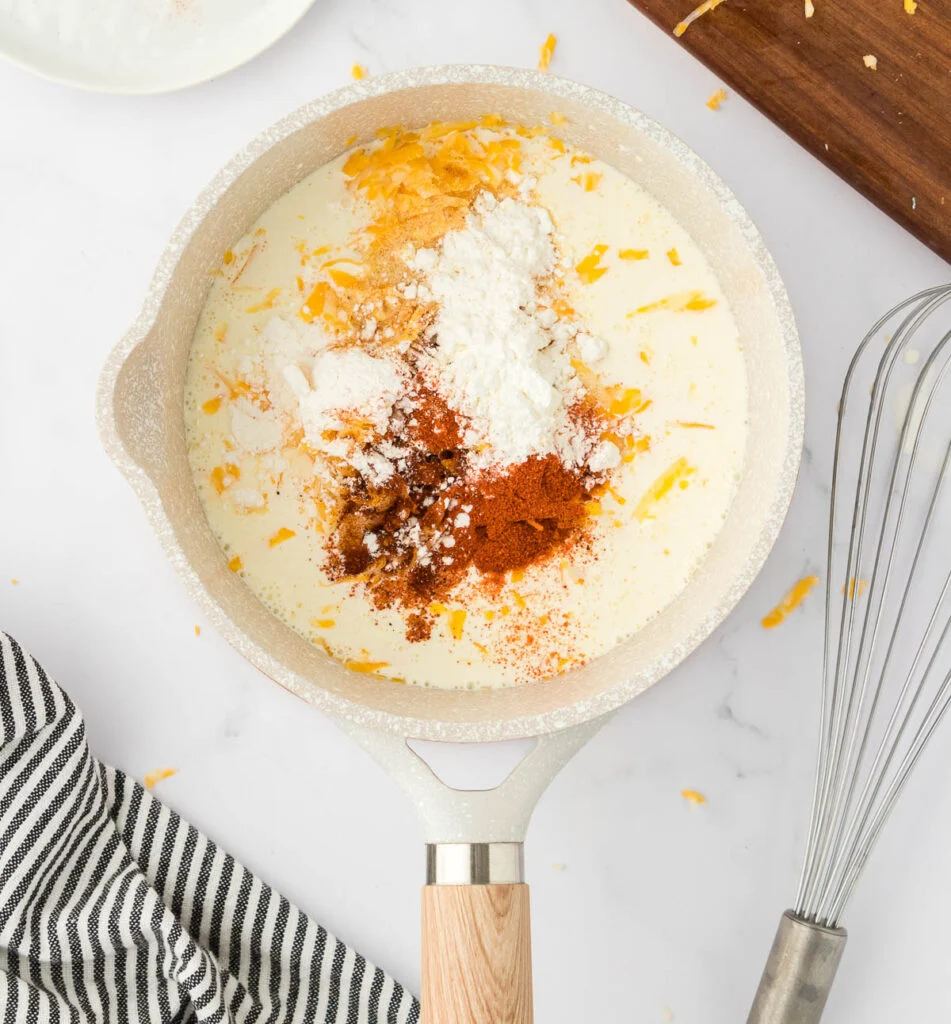 nacho cheese sauce ingredients in a sauce pan