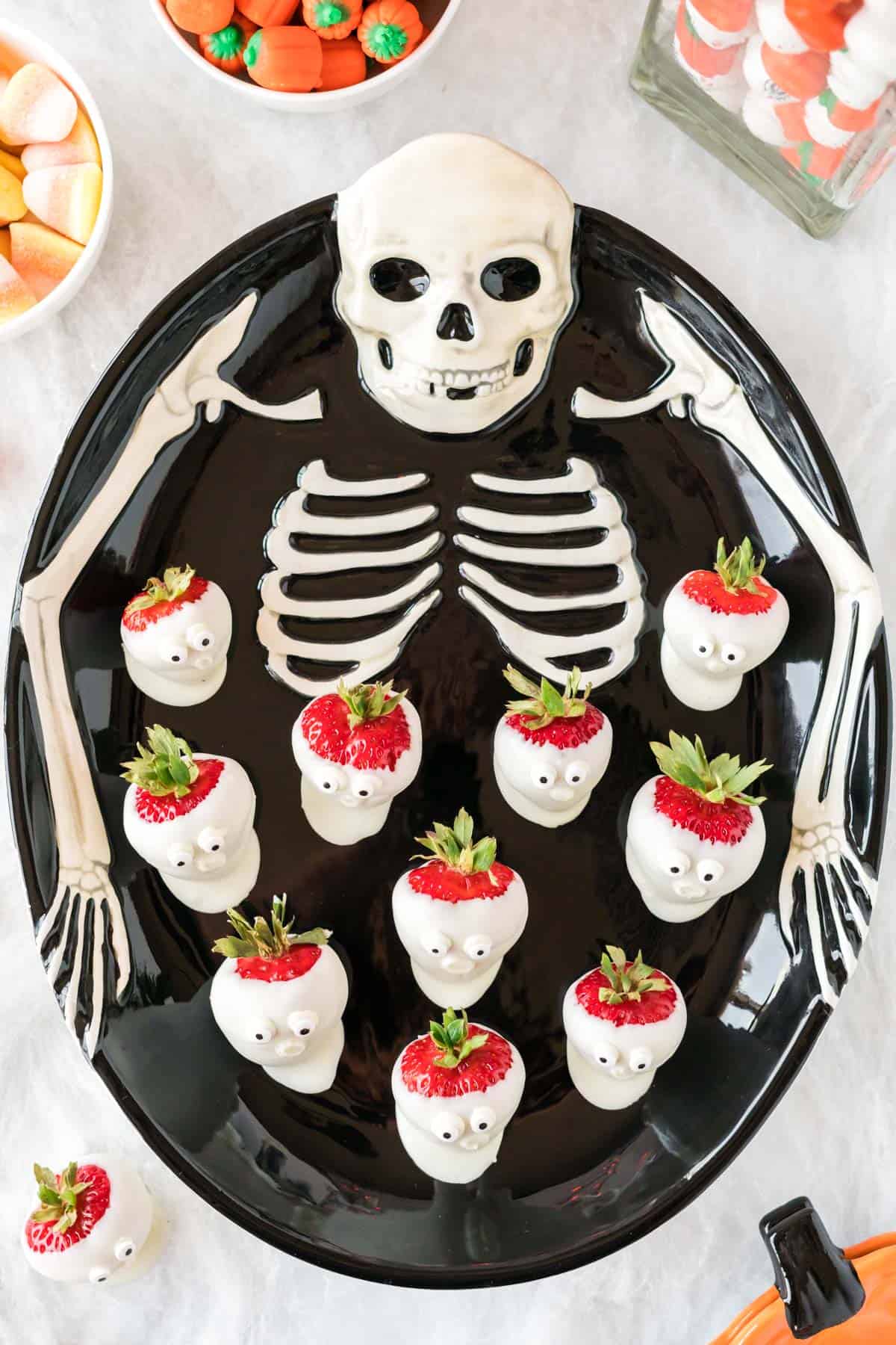 skeleton tray with strawberry ghosts on it