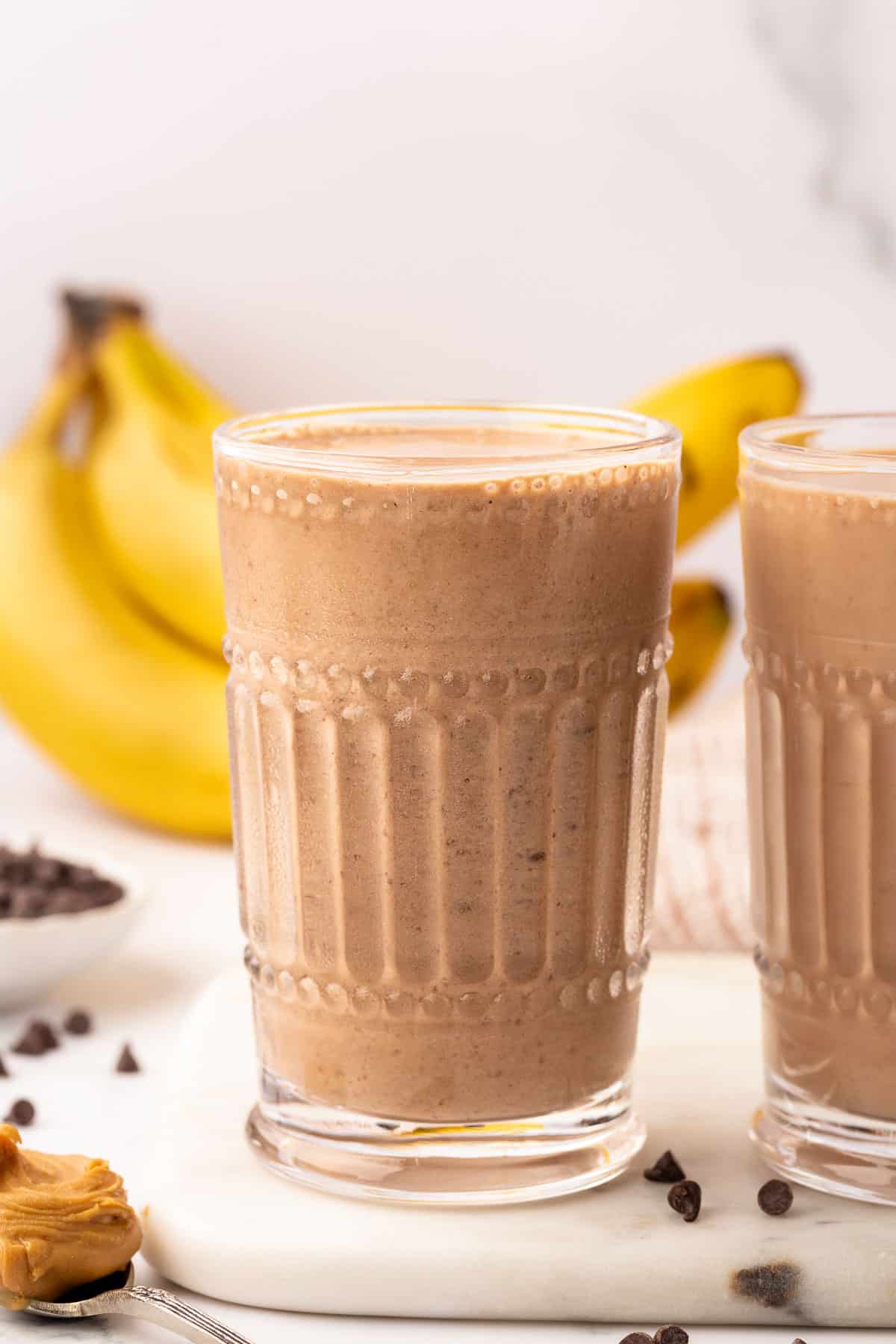 chocolate peanut butter banana smoothie in a glass