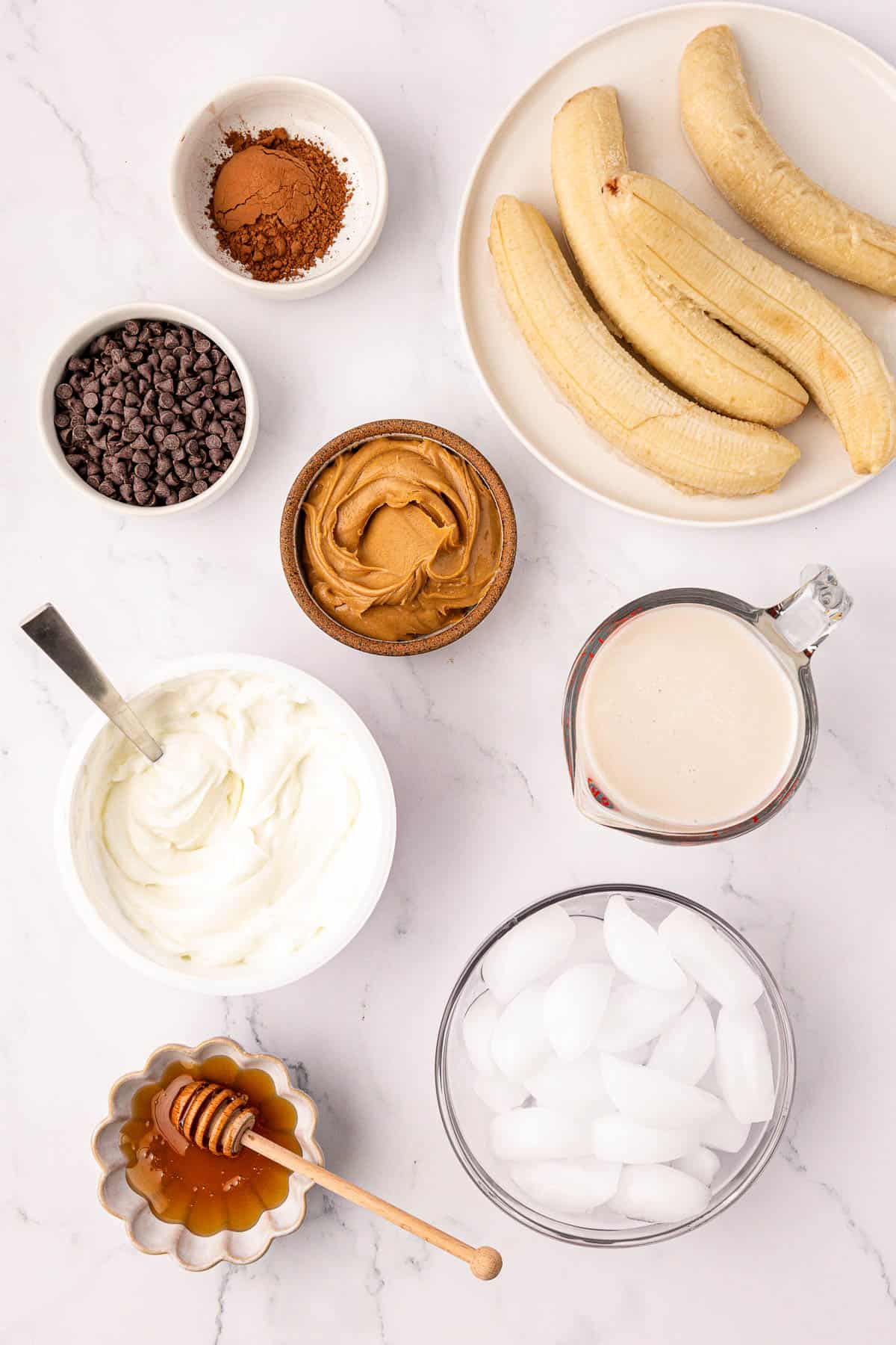 ingredients to make a chocolate peanut butter banana smoothie