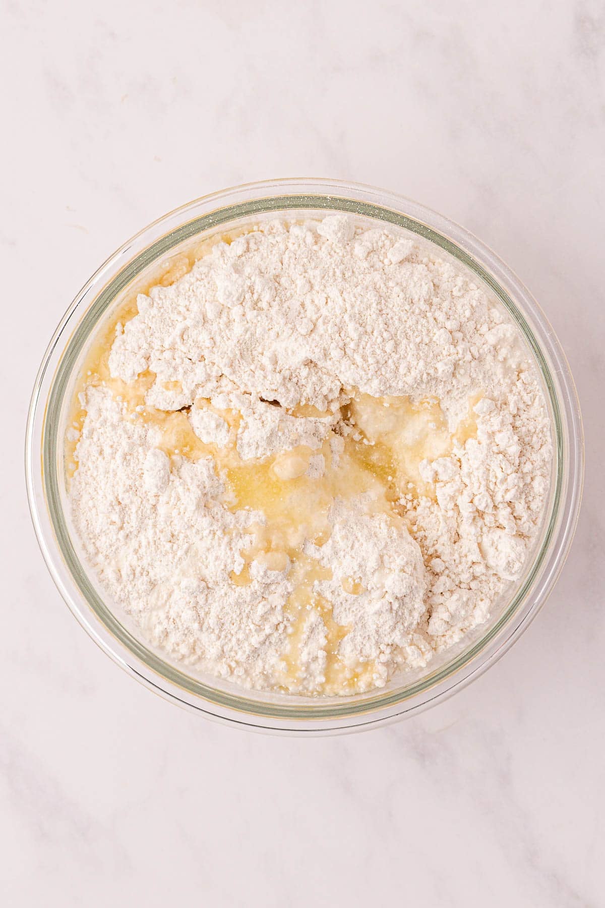 adding the cake mix to the mixing bowl