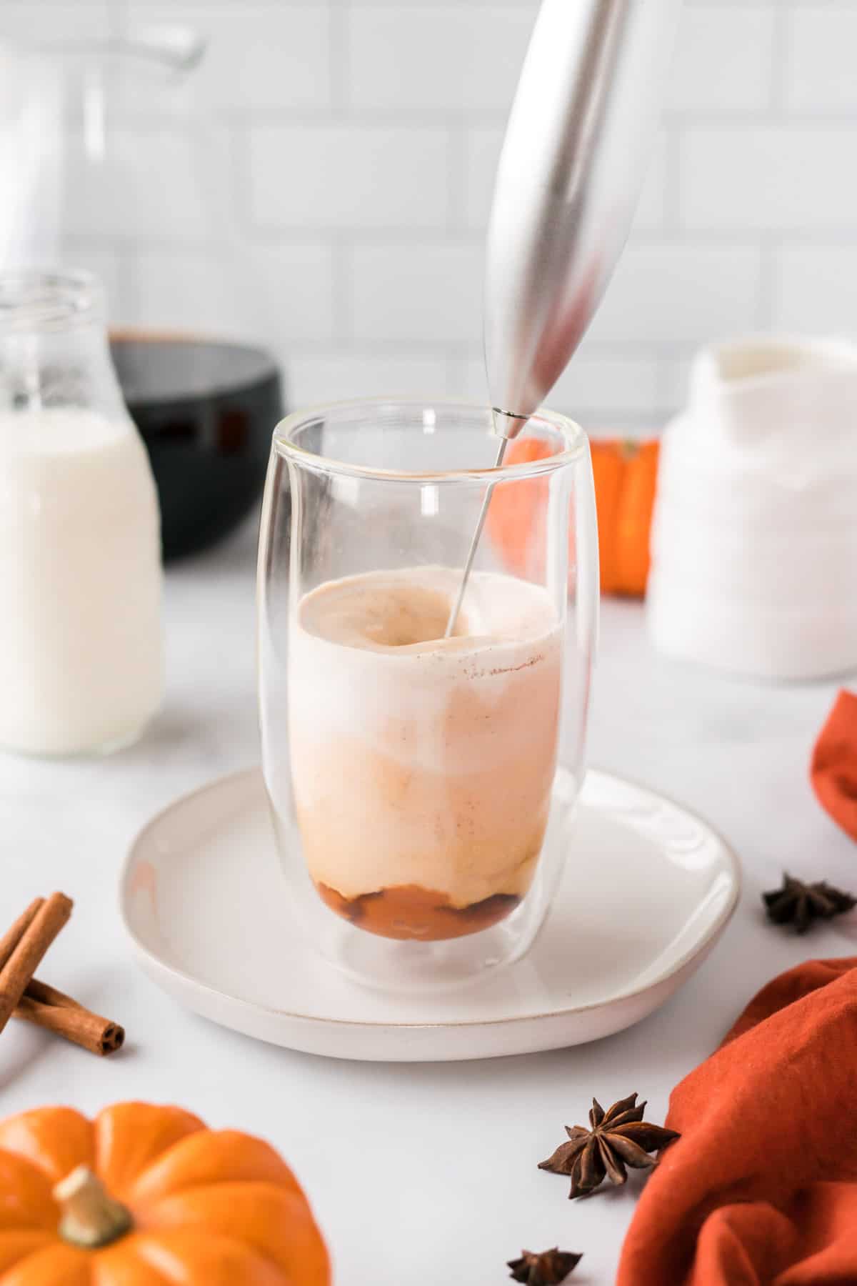 mixing together the pumpkin cream
