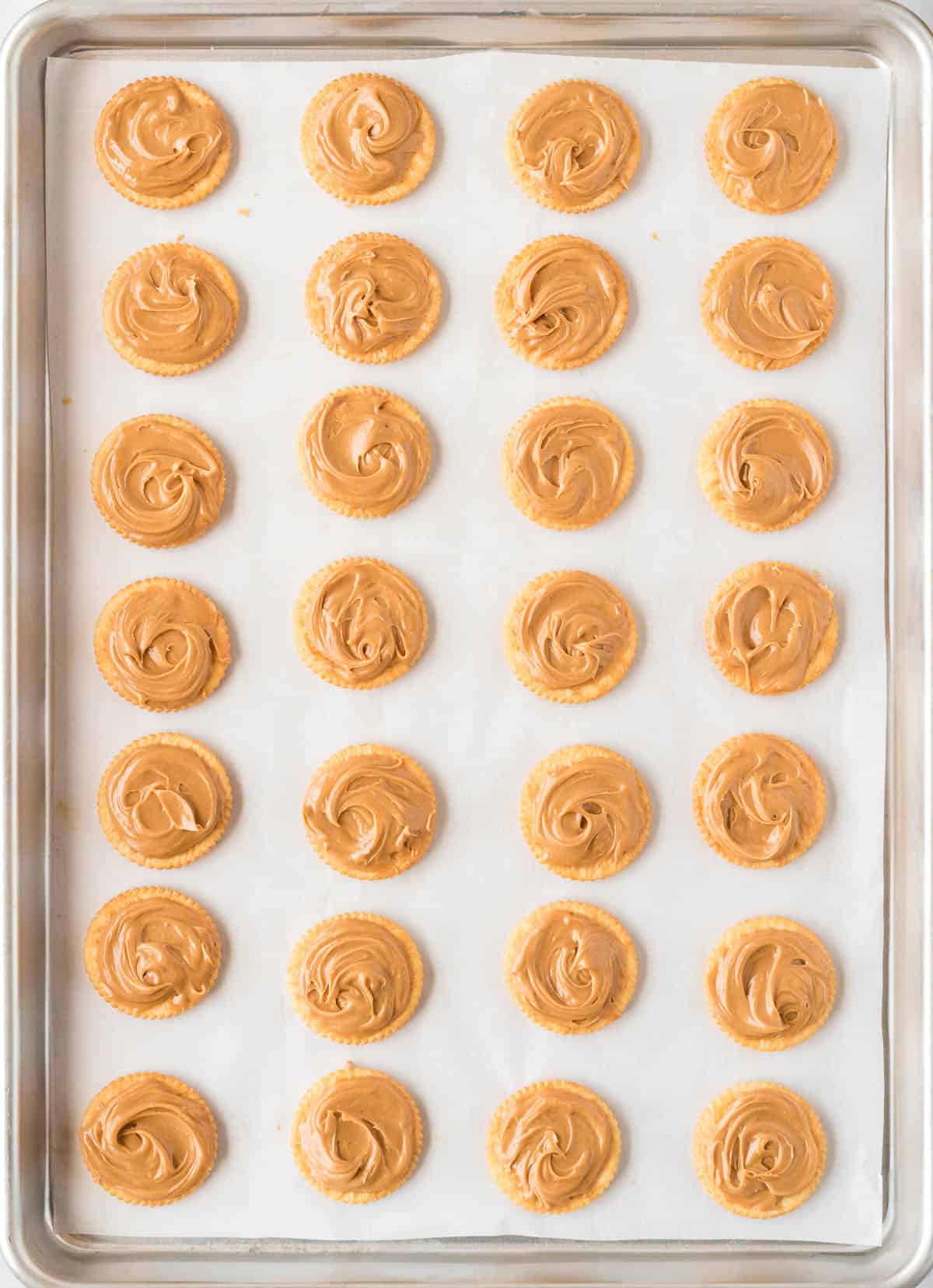 ritz cracker cookies topped with peanut butter