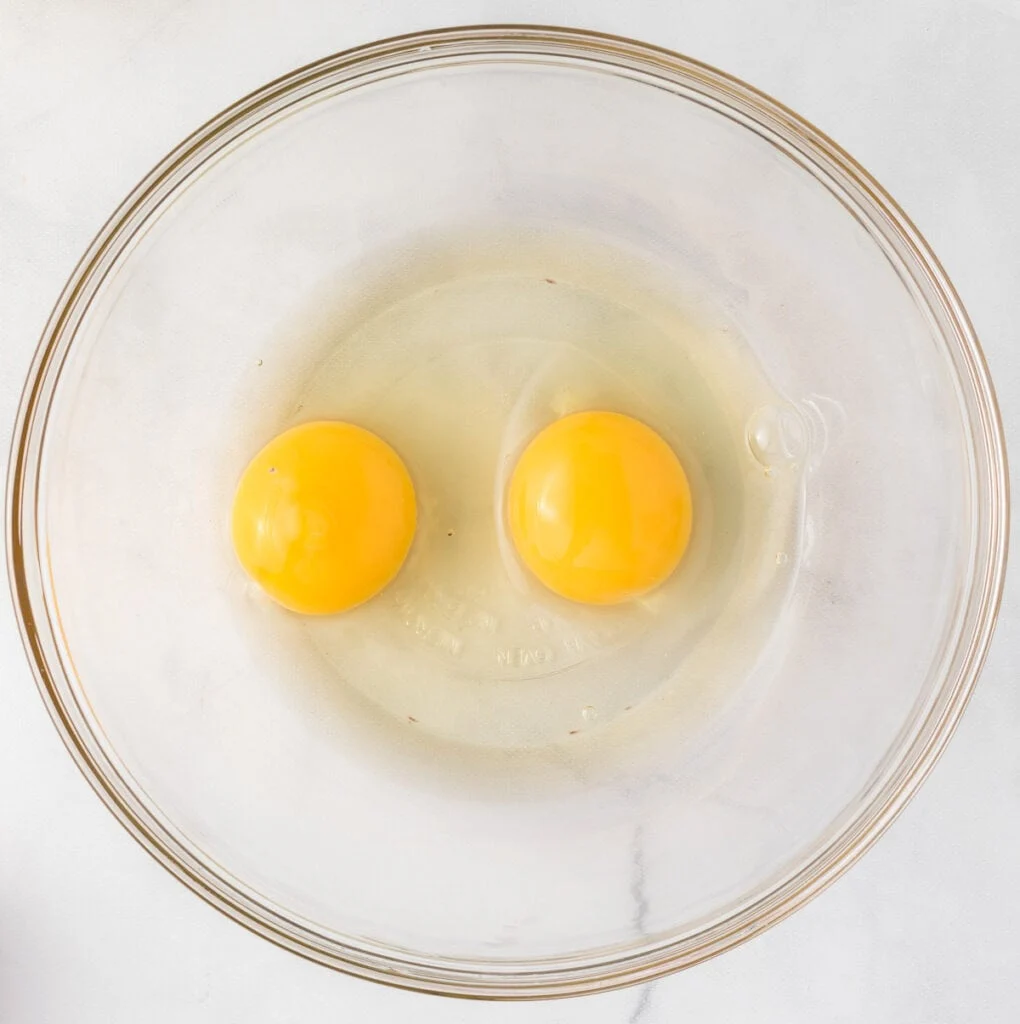 two eggs in a mixing bowl