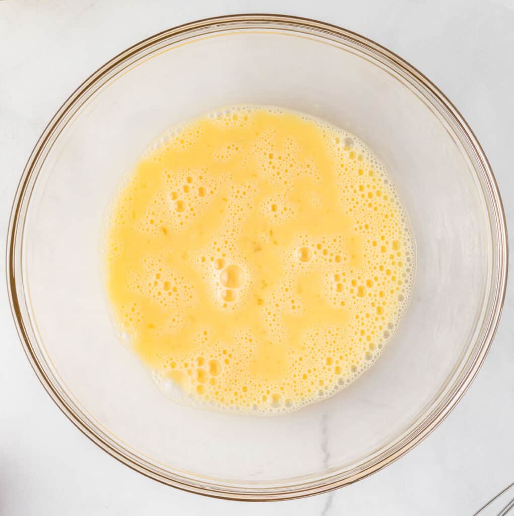 whisked eggs in a mixing bowl