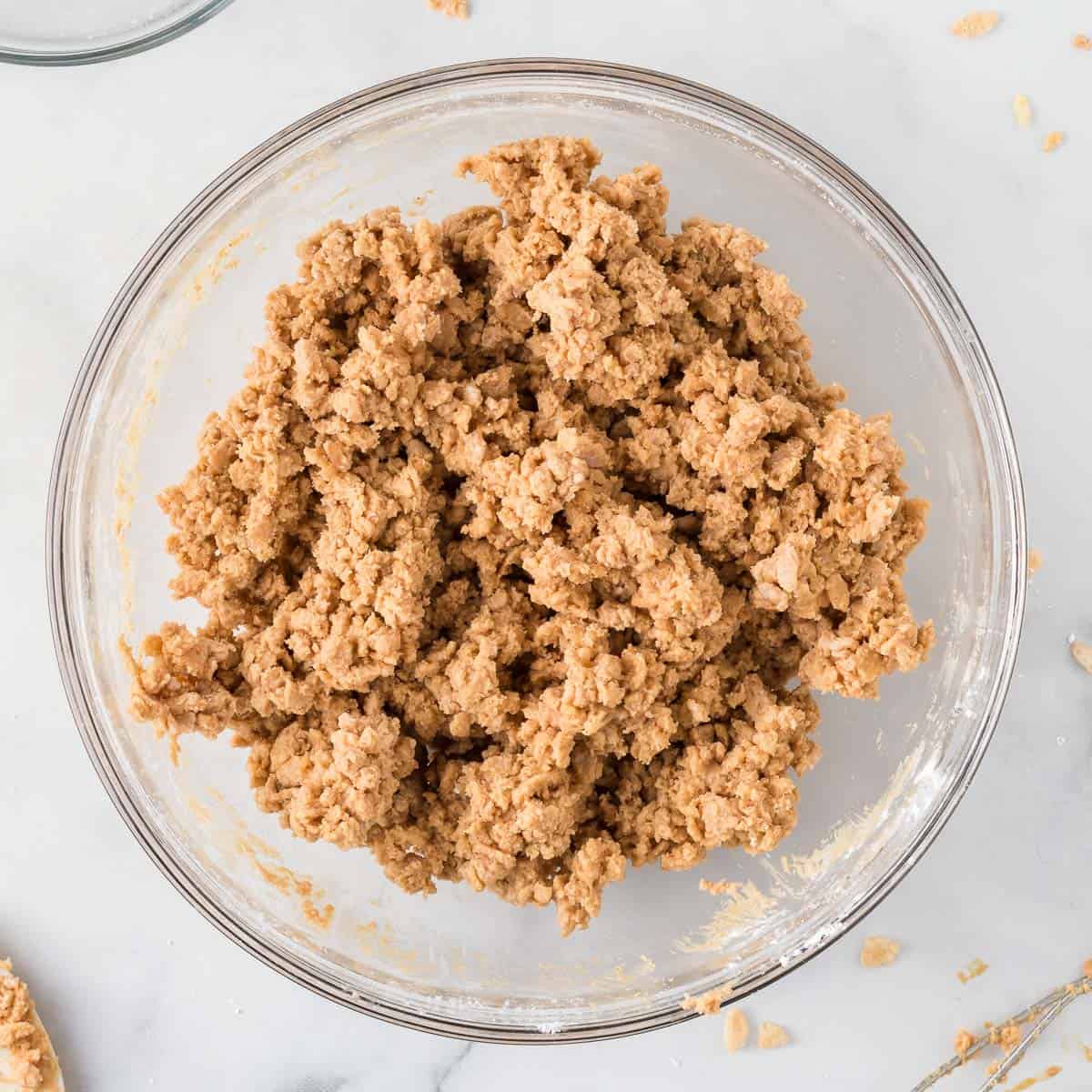 peanut butter mixed together with rice krispies and powdered sugar