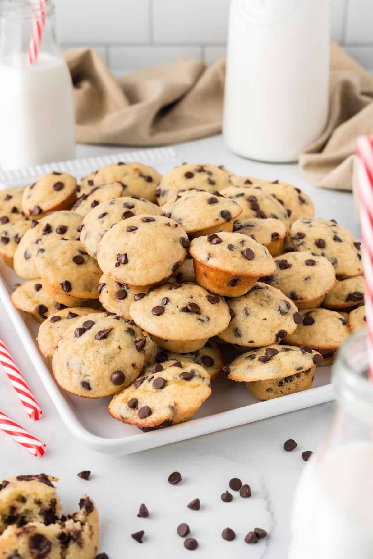 mini chocolate chip muffins stacked on a platter