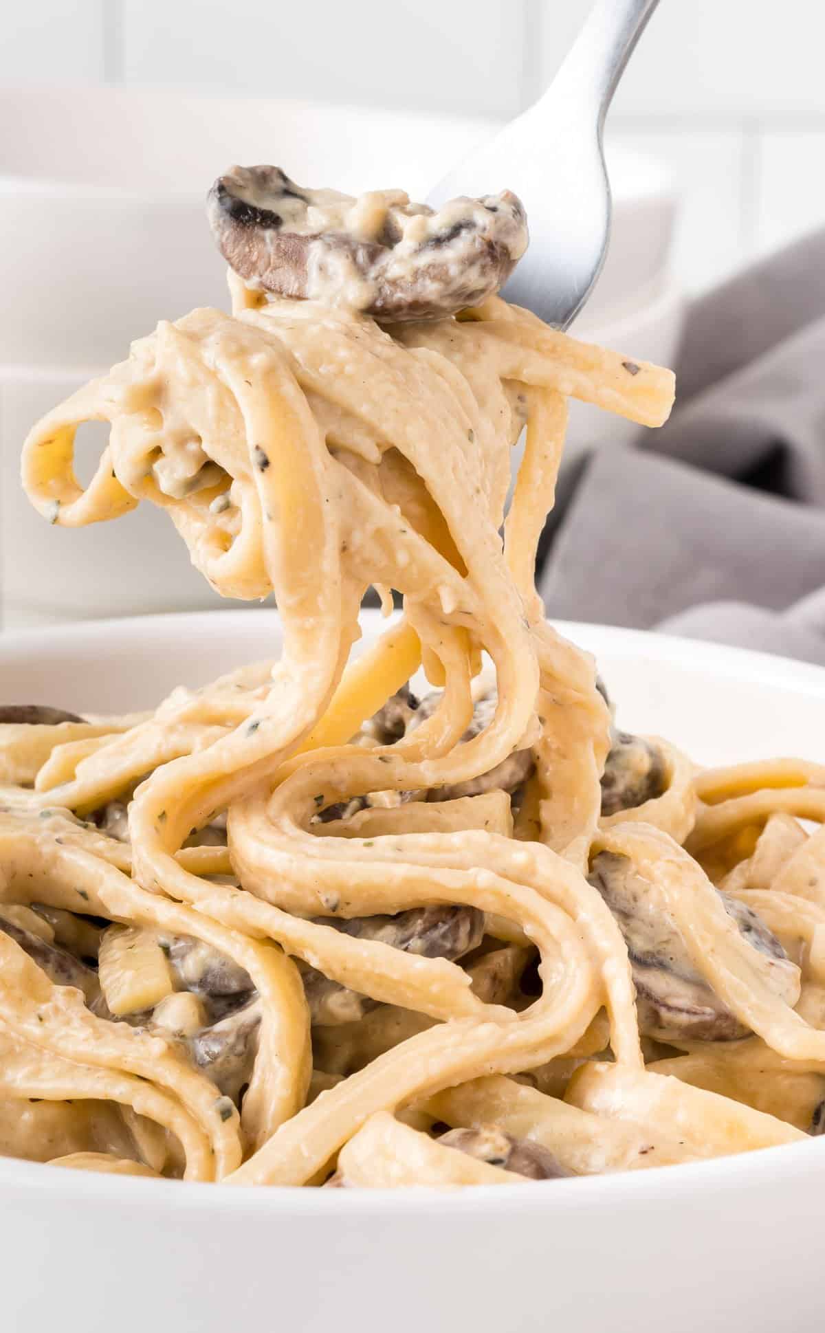 a fork twirling pasta from the bowl