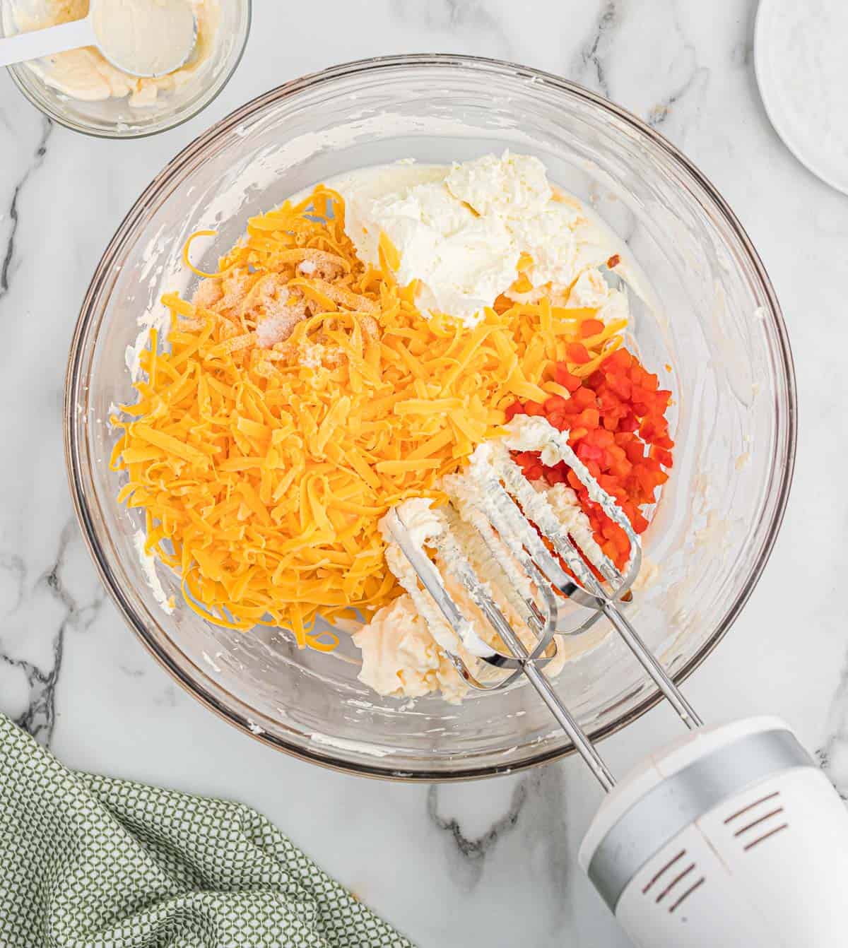 adding the remaining ingredients to the cream cheese