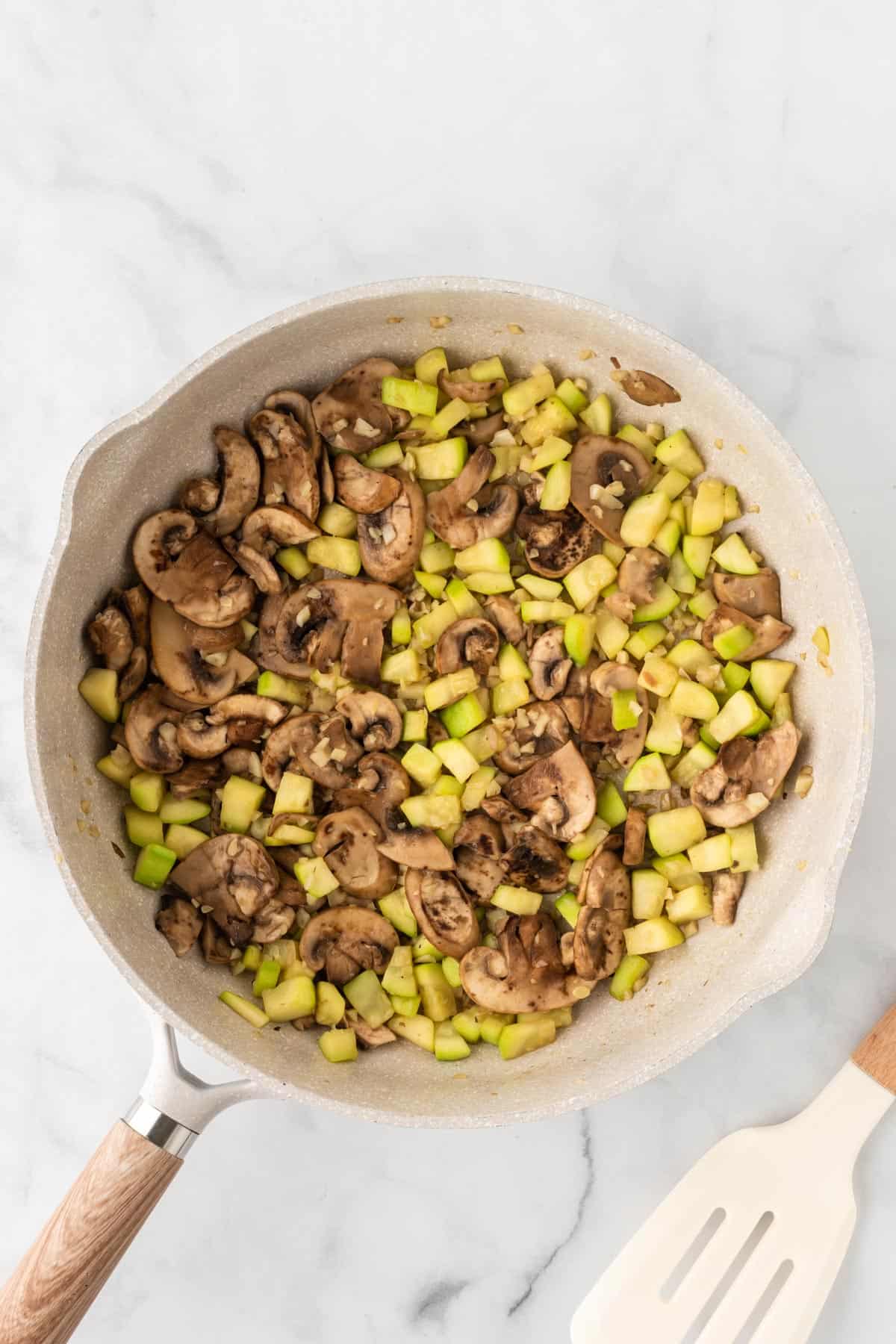 veggies cooked down in a skillet