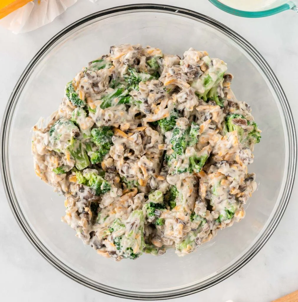 broccoli casserole ingredients in a mixing bowl mixed together