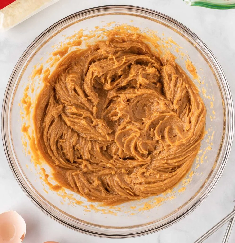 eggs, oil, and peanut butter in a mixing bowl mixed together