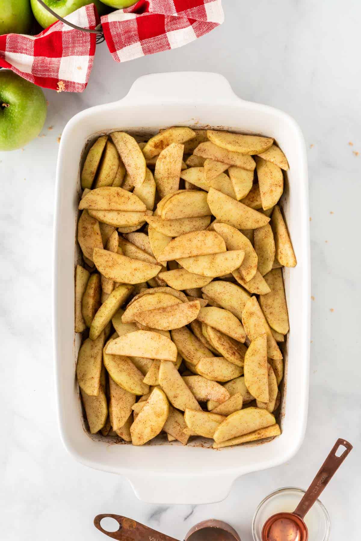 apple slices mixed together with the spices