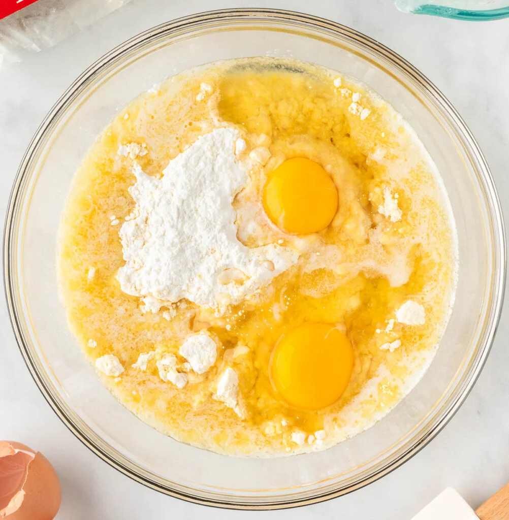 adding eggs and oil to cake batter