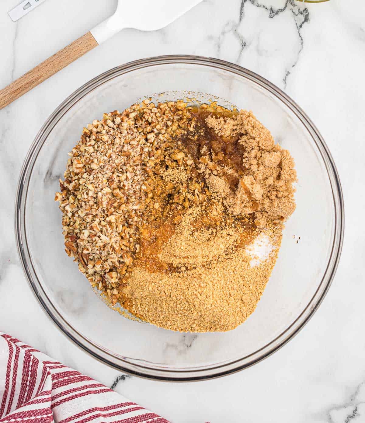 adding the pecan pie filling to a bowl
