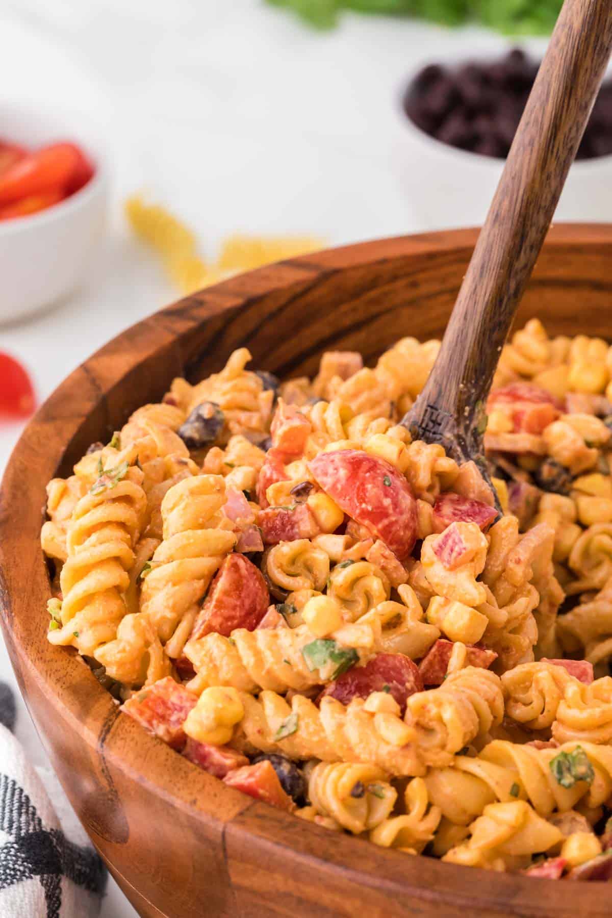southwest pasta salad in a brown serving bowl
