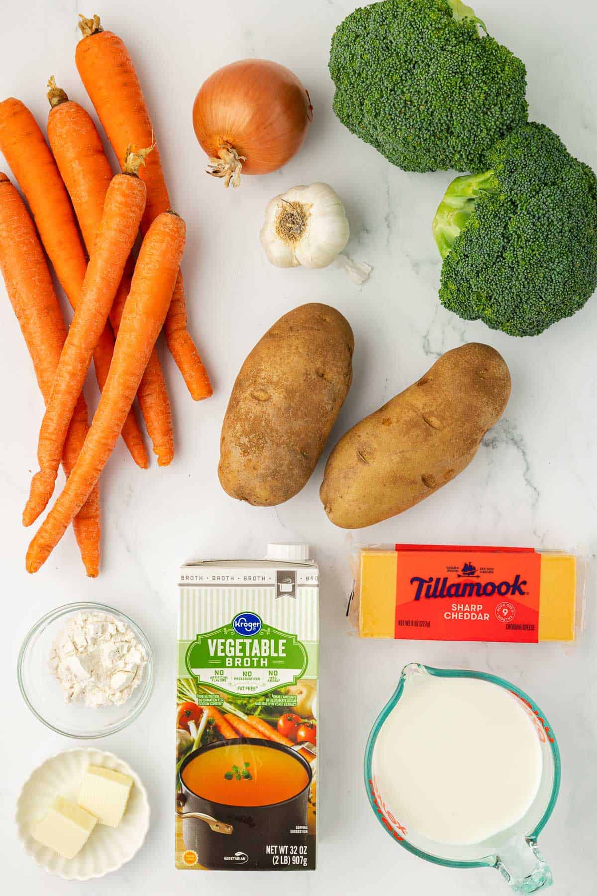 carrots, onion, garlic, broccoli, russet potatoes, butter, flour, vegetable broth, cheese, and milk