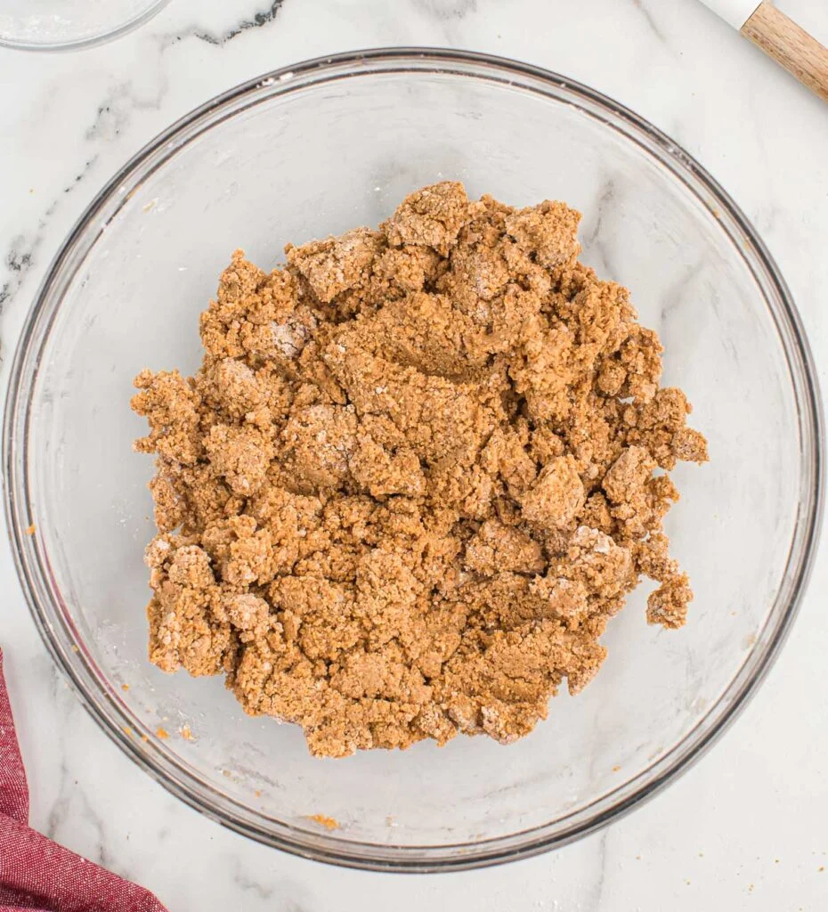 peanut butter balls with graham crackers batter in a mixing bowl