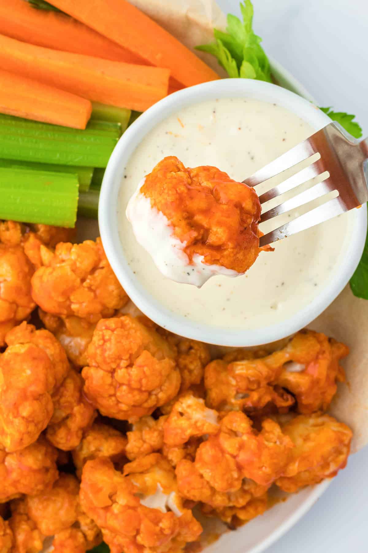 dipping buffalo cauliflower into ranch