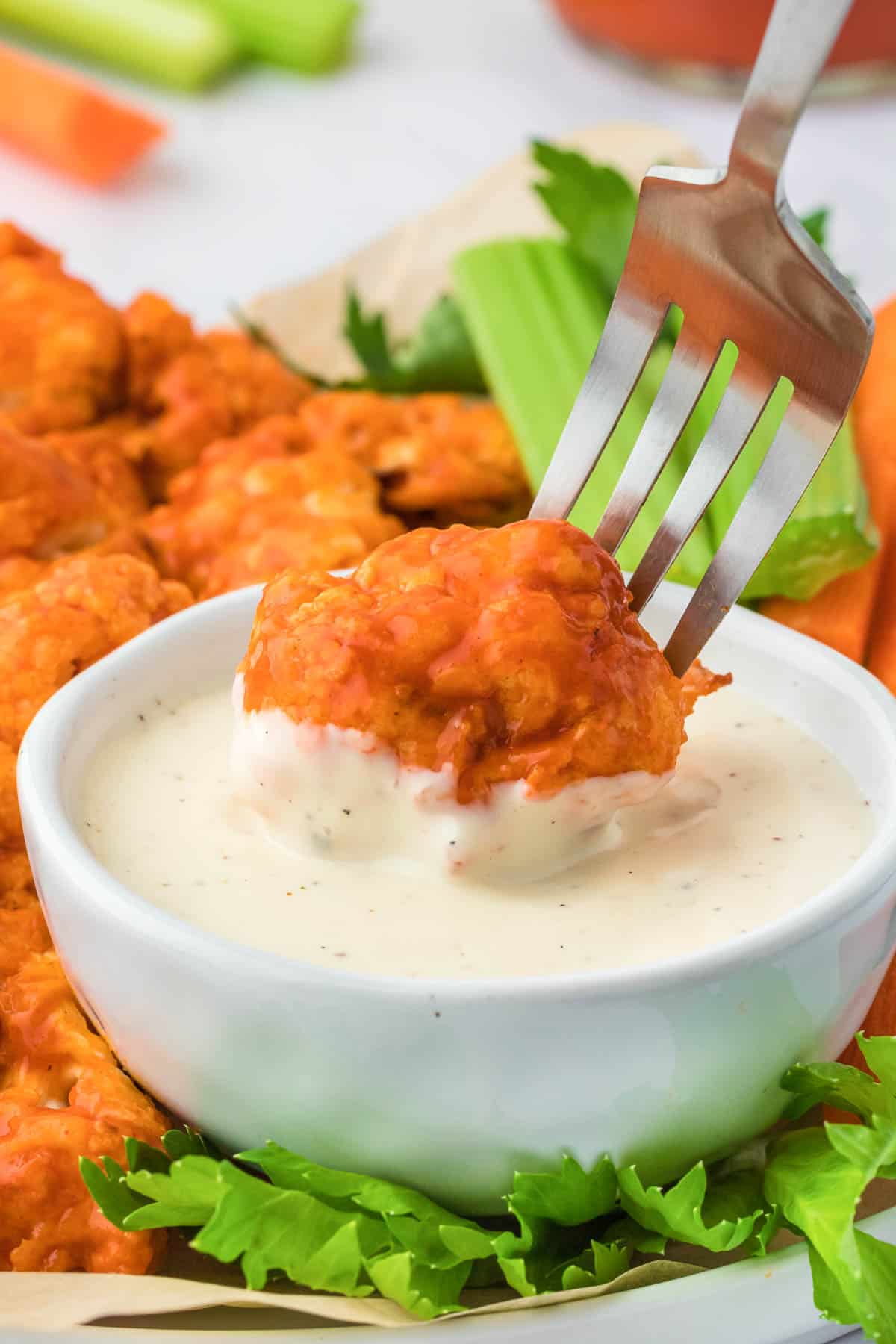 dipping buffalo cauliflower into ranch