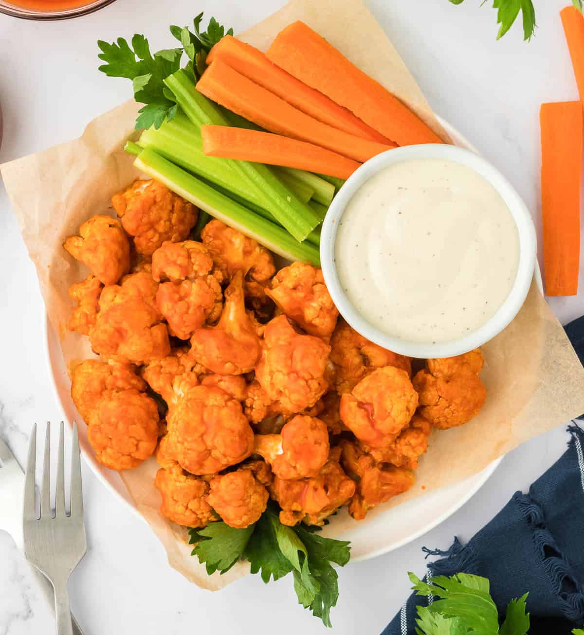 buffalo cauliflower bites with celery, carrots, and ranch